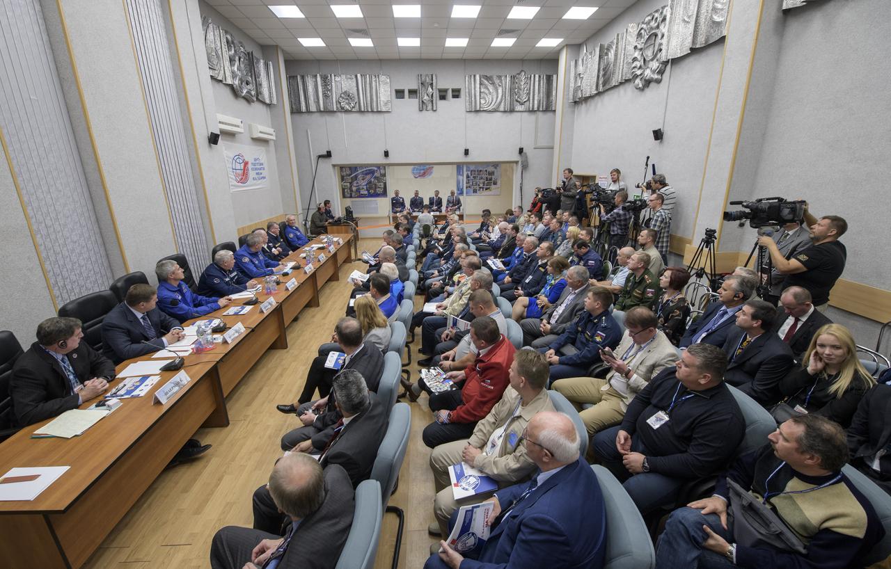 Expedition 57 prime crew members Nick Hague, left, Alexey Ovchinin, second from left, are seen in quarantine behind glass with backup crew members Oleg Kononenko, and David Saint-Jacques, right, during the State Commission meeting to approve the Soyuz launch of Expedition 57 to the International Space Station, Wednesday, Oct. 10, 2018 at the Cosmonaut Hotel in  Baikonur, Kazakhstan. Hague and Ovchinin are scheduled to launch on October 11 and will spend the next six months living and working aboard the International Space Station. Photo Credit: (NASA/Bill Ingalls)