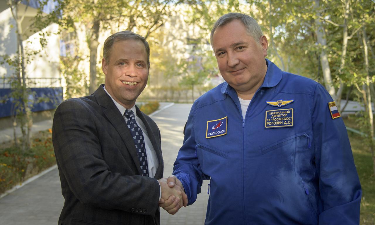 NASA Administrator Jim Bridenstine, left, and Roscosmos Director General Dmitry Rogozin shake hands following a television interview, Wednesday, Oct. 10, 2018 at the Cosmonaut Hotel in Baikonur, Kazakhstan. Brindenstine and Rogozin are in Baikonur to see the launch of Expedition 57 Flight Engineer Nick Hague of NASA and Flight Engineer Alexey Ovchinin of Roscosmos. Photo Credit: (NASA/Bill Ingalls)