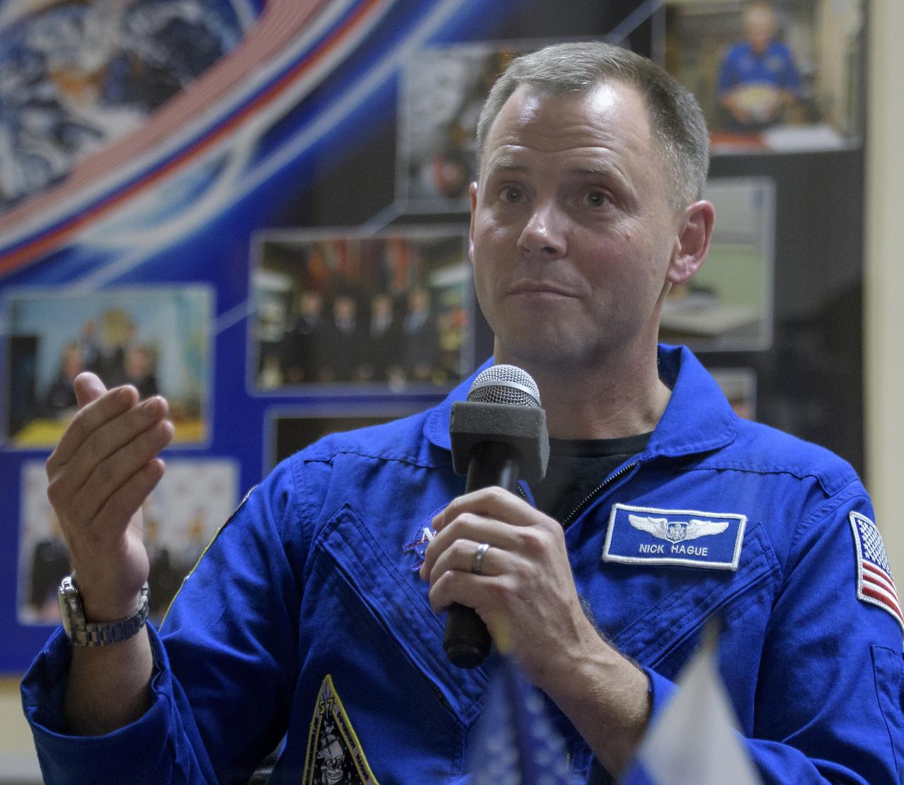 Expedition 57 Flight Engineer Nick Hague of NASA answers questions during a press conference, Wednesday, Oct. 10, 2018 at the Cosmonaut Hotel in Baikonur, Kazakhstan. Hague and Expedition 57 Flight Engineer Alexey Ovchinin of Roscosmos are scheduled to launch on October 11 and will spend the next six months living and working aboard the International Space Station. Photo Credit: (NASA/Bill Ingalls)