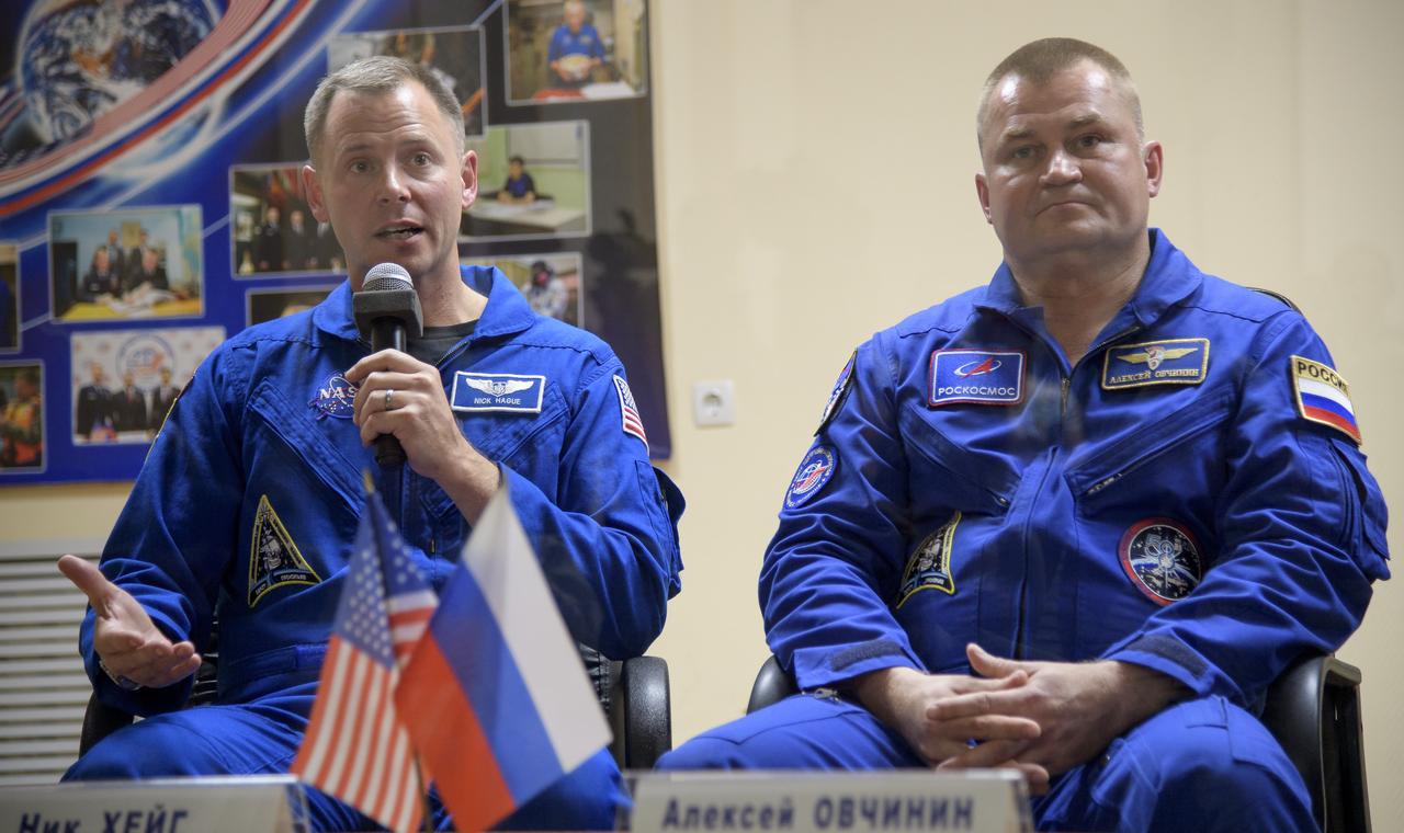 Expedition 57 prime crew members Nick Hague, left, Alexey Ovchinin are seen during a press conference, Wednesday, Oct. 10, 2018 at the Cosmonaut Hotel in Baikonur, Kazakhstan. Hague and Ovchinin are scheduled to launch on October 11 and will spend the next six months living and working aboard the International Space Station. Photo Credit: (NASA/Bill Ingalls)