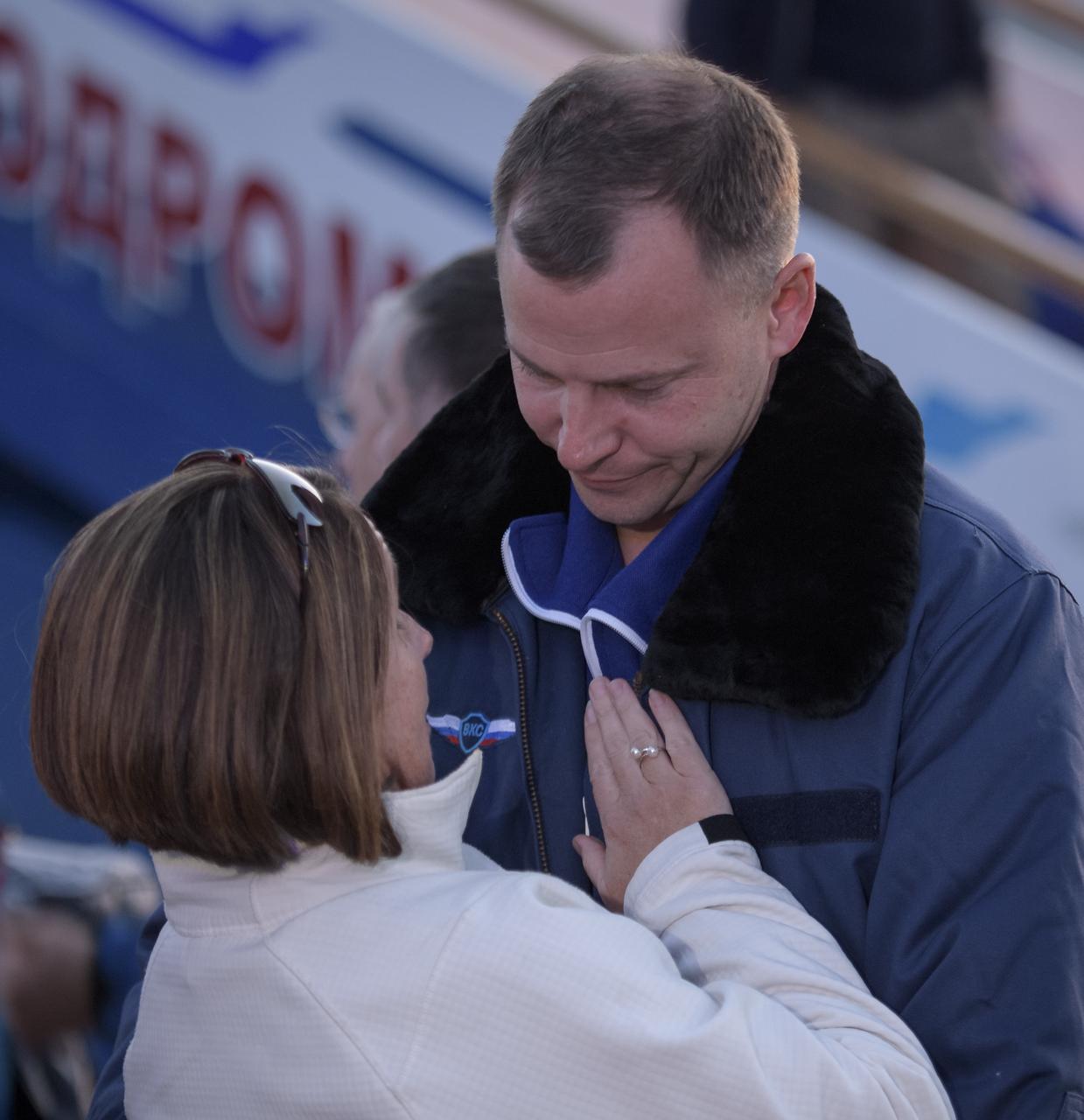 Expedition 57 Flight Engineer Nick Hague of NASA embraces his wife Catie after landing at the Krayniy Airport with Expedition 57 Flight Engineer Alexey Ovchinin of Roscosmos, Thursday, Oct. 11, 2018 in Baikonur, Kazakhstan. Hague and Ovchinin arrived from Zhezkazgan after Russian Search and Rescue teams brought them from the Soyuz landing site. During the Soyuz MS-10 spacecraft's climb to orbit, an anomaly occurred, resulting in an abort downrange. The crew was quickly recovered and is in good condition. Photo Credit: (NASA/Bill Ingalls)