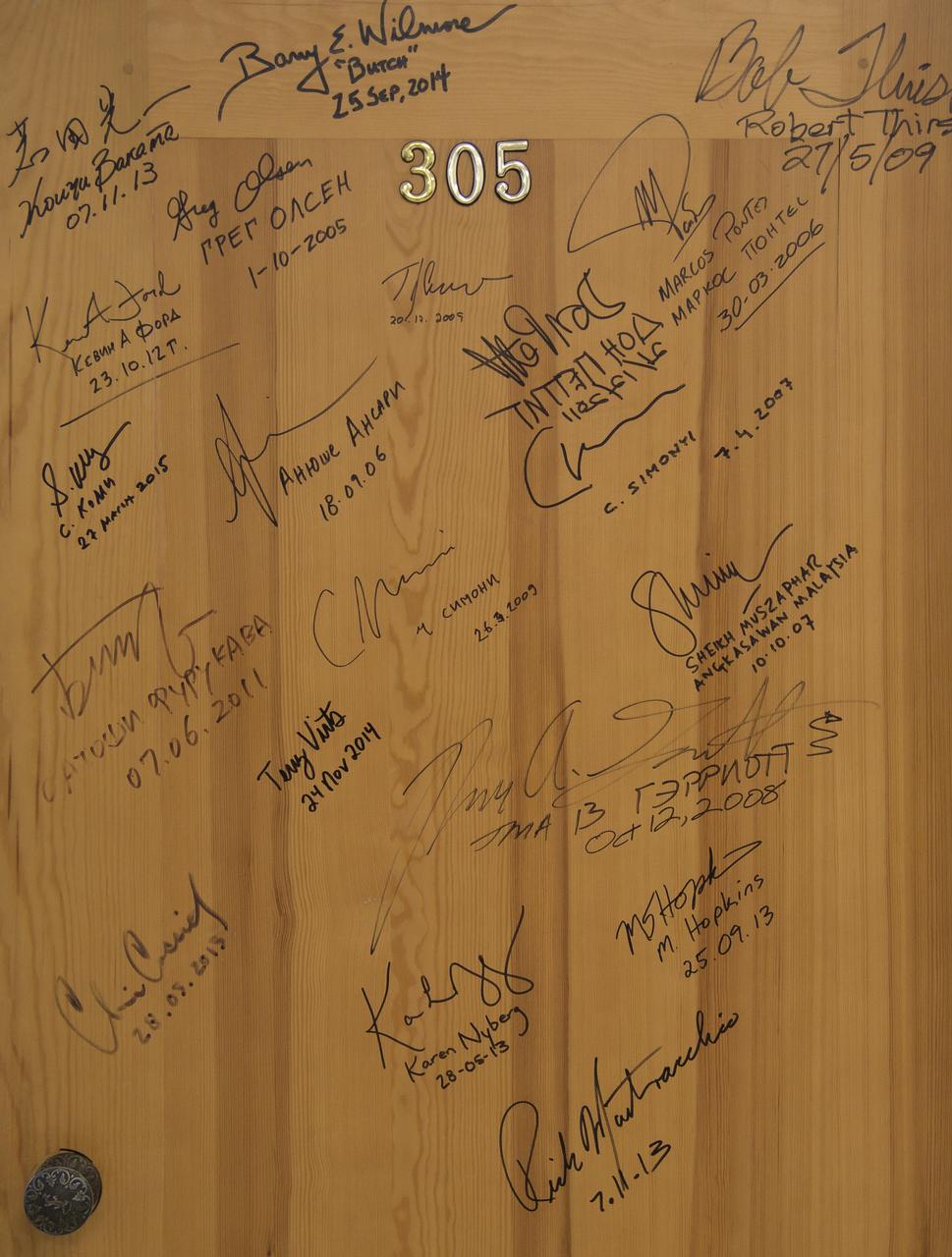 Cosmonaut Hotel with signatures of previous International Space Station crews awaits the prelaunch signatures of Expedition 57 Flight Engineer Nick Hague of NASA, and Flight Engineer Alexey Ovchinin of Roscosmos, Thursday, Oct. 11, 2018 in Baikonur, Kazakhstan. During the Soyuz spacecraft's climb to orbit, an anomaly occurred, resulting in an abort downrange. The crew was quickly recovered and is in good condition. Photo Credit: (NASA/Bill Ingalls)