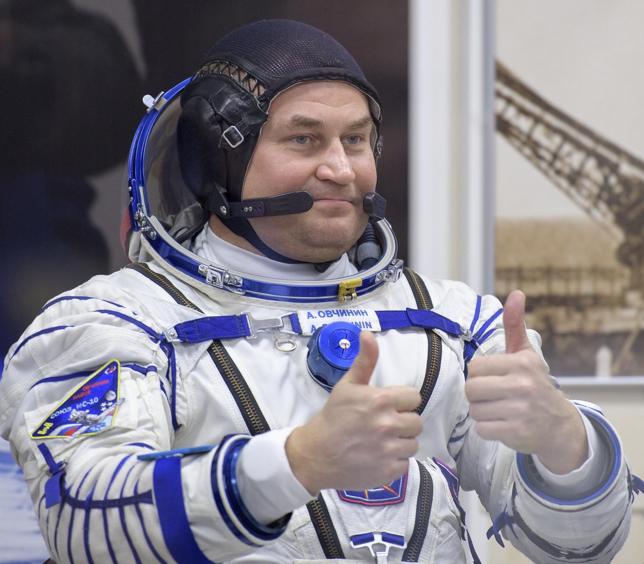 Expedition 57 Flight Engineer Alexey Ovchinin of Roscosmos gives a thumbs up after having his Sokol suit pressure checked ahead of his launch on a Soyuz rocket with Flight Engineer Nick Hague of NASA, Thursday, Oct. 11, 2018 at the Baikonur Cosmodrome in Kazakhstan. During the Soyuz spacecraft's climb to orbit, an anomaly occurred, resulting in an abort downrange. The crew was quickly recovered and is in good condition. Photo Credit: (NASA/Bill Ingalls)