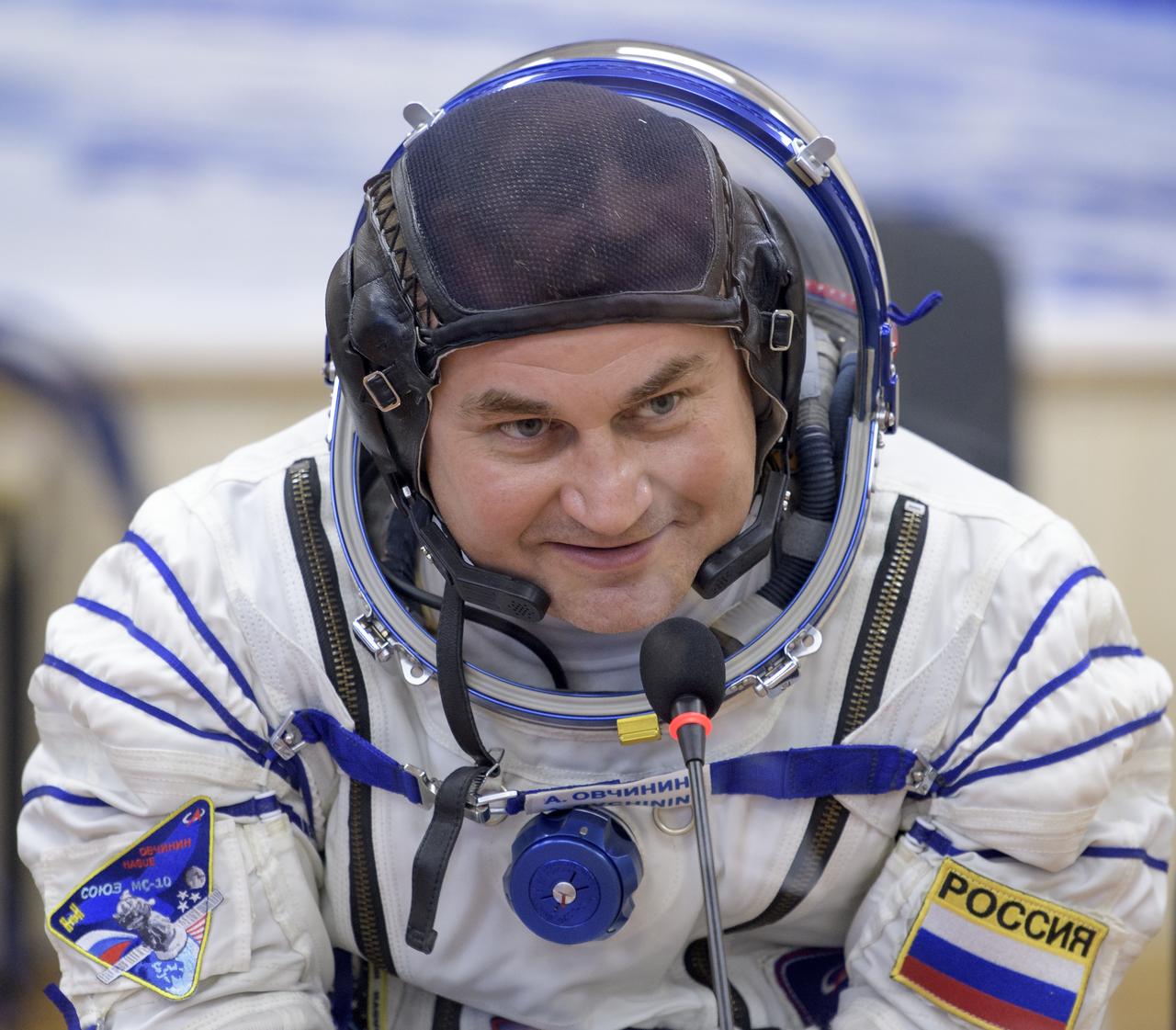 Expedition 57 Flight Engineer Alexey Ovchinin of Roscosmos talks with his family after having his Sokol suit pressure checked ahead of his launch on a Soyuz rocket with Flight Engineer Nick Hague of NASA, Thursday, Oct. 11, 2018 at the Baikonur Cosmodrome in Kazakhstan. During the Soyuz spacecraft's climb to orbit, an anomaly occurred, resulting in an abort downrange. The crew was quickly recovered and is in good condition. Photo Credit: (NASA/Bill Ingalls)