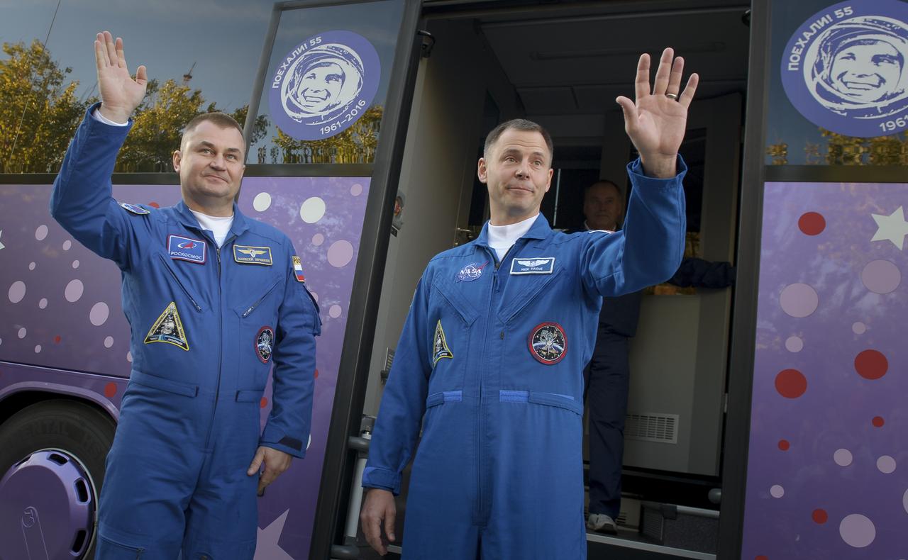 Expedition 57 Flight Engineer Alexey Ovchinin of Roscosmos, left, and Flight Engineer Nick Hague of NASA wave farewell outside the Cosmonaut Hotel prior to departing for launch on a Soyuz rocket, Thursday, Oct. 11, 2018 in Baikonur, Kazakhstan. During the Soyuz spacecraft's climb to orbit, an anomaly occurred, resulting in an abort downrange. The crew was quickly recovered and is in good condition. Photo Credit: (NASA/GCTC/Irina Spector)