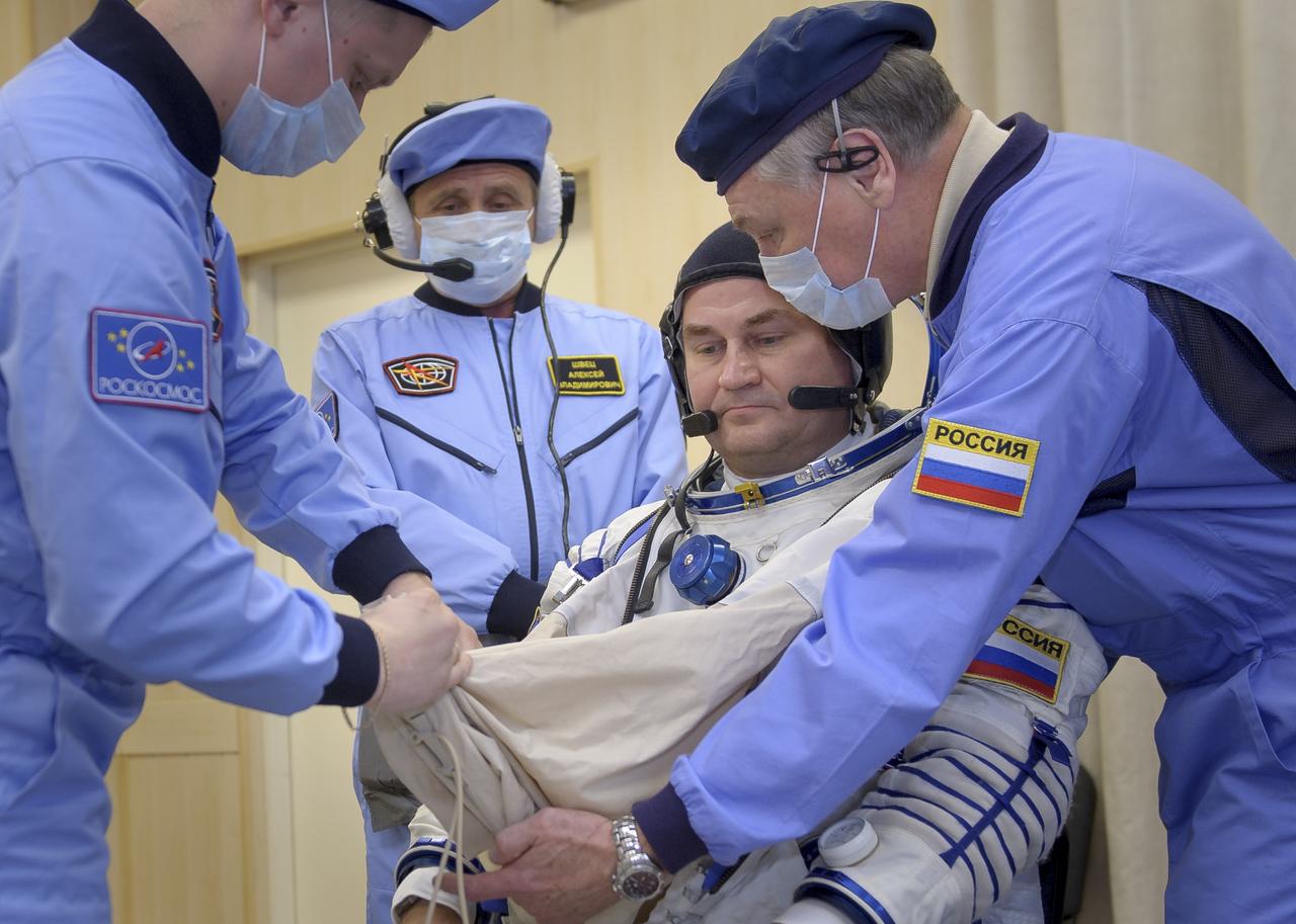 Expedition 57 Flight Engineer Alexey Ovchinin of Roscosmos dons his Sokol suit ahead of his launch on a Soyuz rocket with Flight Engineer Nick Hague of NASA, Thursday, Oct. 11, 2018 at the Baikonur Cosmodrome in Kazakhstan. During the Soyuz spacecraft's climb to orbit, an anomaly occurred, resulting in an abort downrange. The crew was quickly recovered and is in good condition. Photo Credit: (NASA/GCTC/Irina Spector)