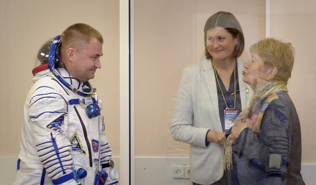 Expedition 57 Flight Engineer Alexey Ovchinin of Roscosmos is blown a kiss by his mother after having donned his Sokol suit for his launch on a Soyuz rocket with Flight Engineer Nick Hague of NASA, Thursday, Oct. 11, 2018 at the Baikonur Cosmodrome in Kazakhstan. During the Soyuz spacecraft's climb to orbit, an anomaly occurred, resulting in an abort downrange. The crew was quickly recovered and is in good condition. Photo Credit: (NASA/GCTC/Irina Spector)