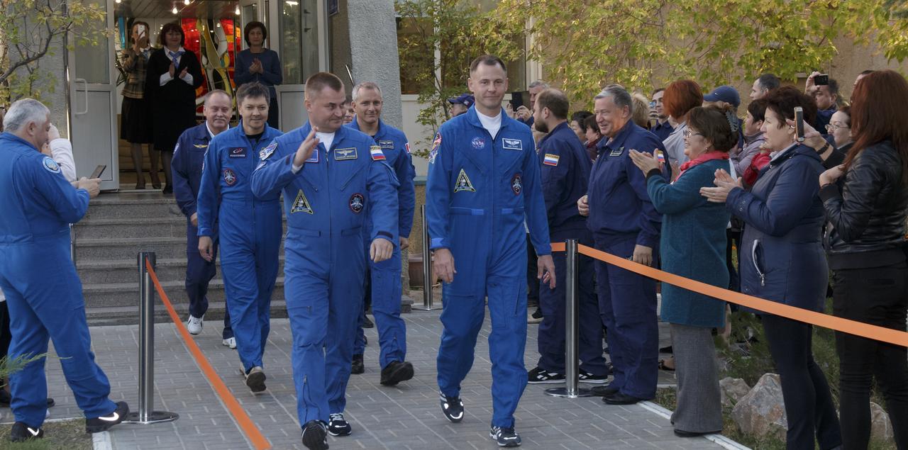 Expedition 57 Flight Engineer Alexey Ovchinin of Roscosmos, left, and Flight Engineer Nick Hague of NASA, are seen as they depart the Cosmonaut Hotel to suit-up for their Soyuz launch to the International Space Station, Thursday, Oct. 11, 2018 in Baikonur, Kazakhstan. During the Soyuz spacecraft's climb to orbit, an anomaly occurred, resulting in an abort downrange. The crew was quickly recovered and is in good condition. Photo Credit: (NASA/Victor Zelentsov)