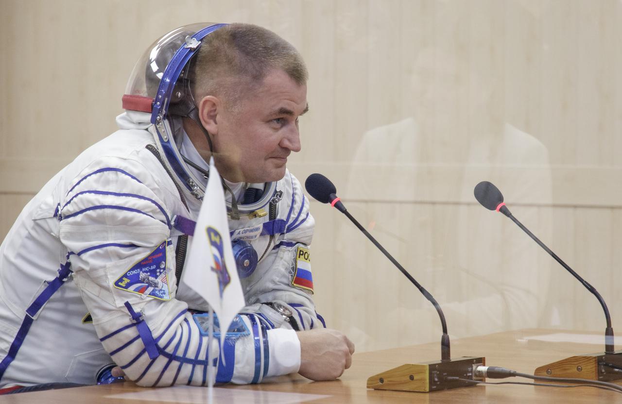 Expedition 57 Flight Engineer Alexey Ovchinin of Roscosmos talks to his family after having his Sokol suit pressure checked ahead of his launch on a Soyuz rocket with Flight Engineer Nick Hague of NASA, Thursday, Oct. 11, 2018 at the Baikonur Cosmodrome in Kazakhstan. During the Soyuz spacecraft's climb to orbit, an anomaly occurred, resulting in an abort downrange. The crew was quickly recovered and is in good condition. Photo Credit: (NASA/Victor Zelentsov)