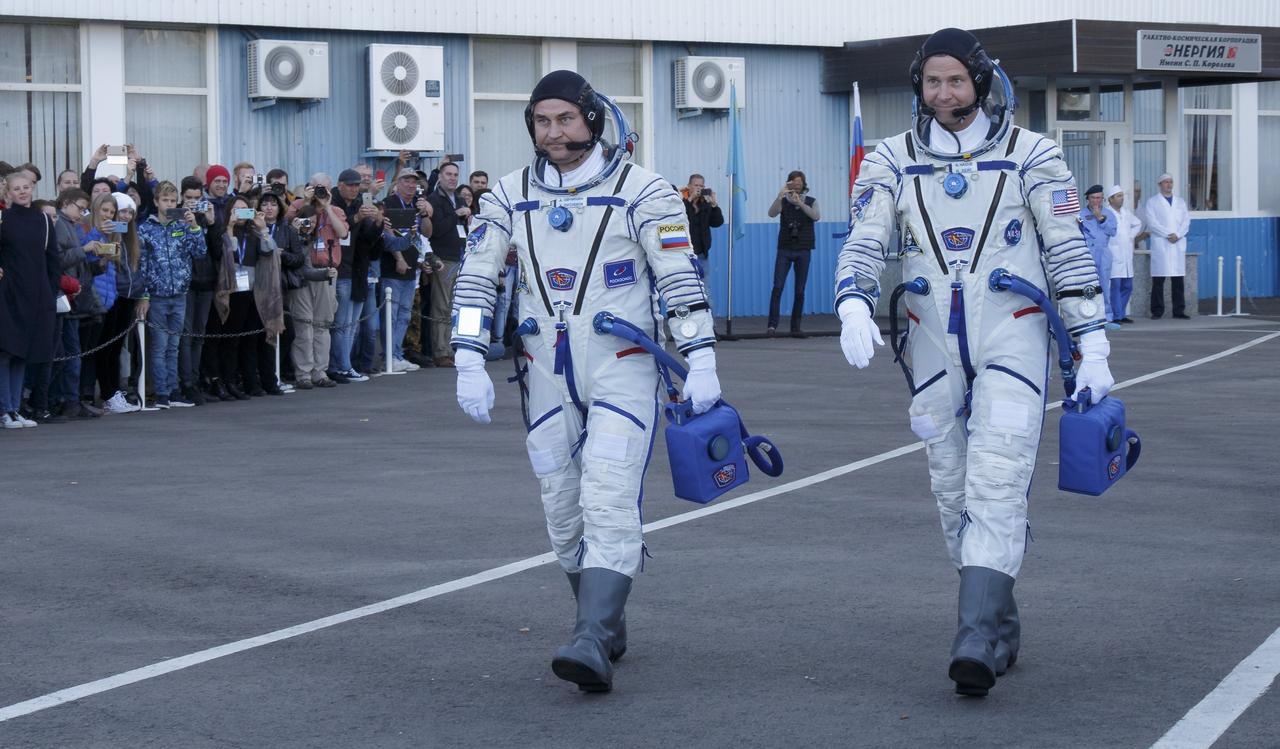 Expedition 57 Flight Engineer Alexey Ovchinin of Roscosmos, left, and Flight Engineer Nick Hague of NASA depart building 254 for their launch on a Soyuz rocket, Thursday, Oct. 11, 2018 at the Baikonur Cosmodrome in Kazakhstan. During the Soyuz spacecraft's climb to orbit, an anomaly occurred, resulting in an abort downrange. The crew was quickly recovered and is in good condition. Photo Credit: (NASA/Victor Zelentsov)