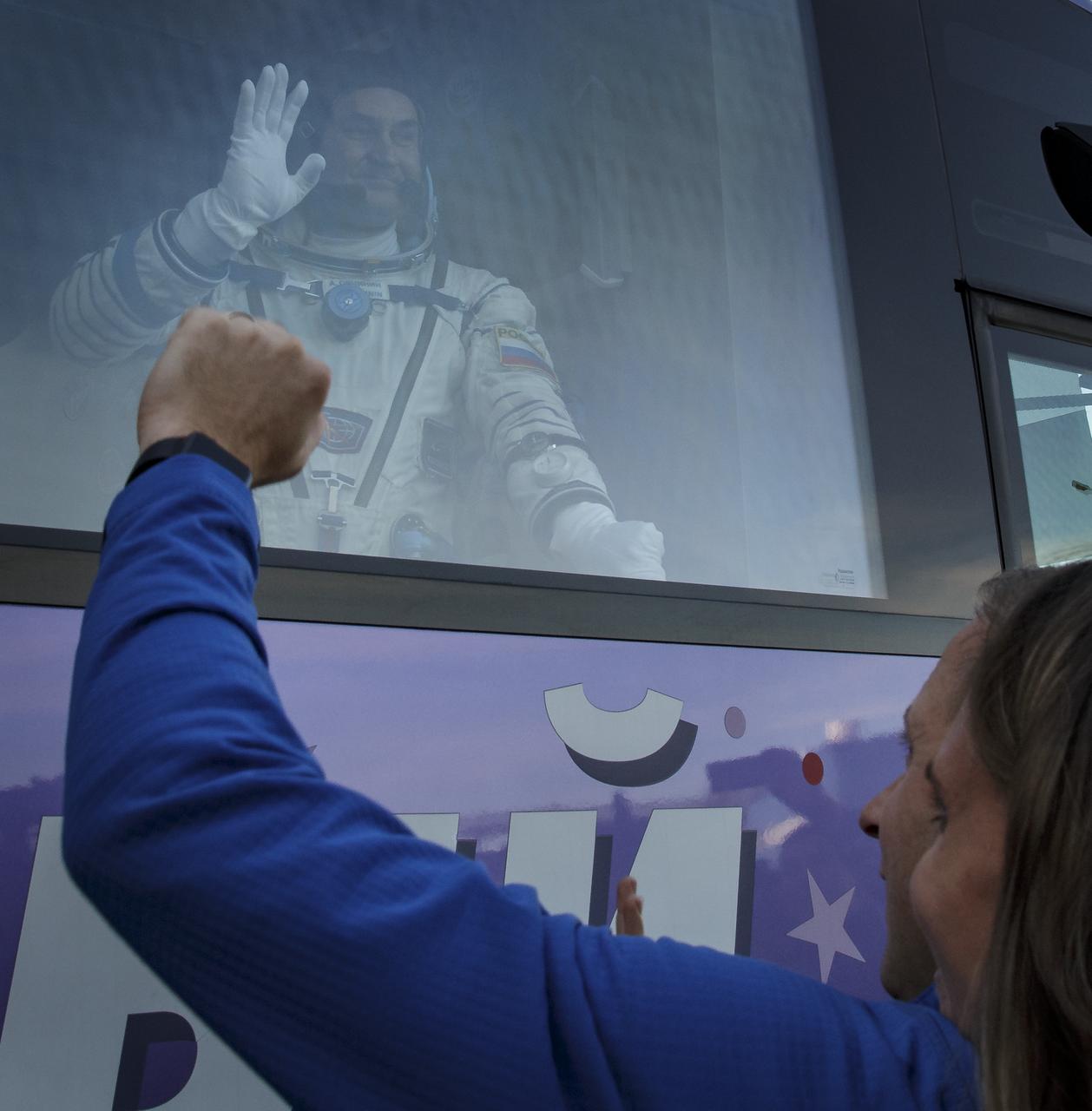 Expedition 57 Flight Engineer Alexey Ovchinin of Roscosmos waves farewell to family and friends as he departs building 254 for launch on a Soyuz rocket with Flight Engineer Nick Hague of NASA, Thursday, Oct. 11, 2018 at the Baikonur Cosmodrome in Kazakhstan. During the Soyuz spacecraft's climb to orbit, an anomaly occurred, resulting in an abort downrange. The crew was quickly recovered and is in good condition. Photo Credit: (NASA/Victor Zelentsov)