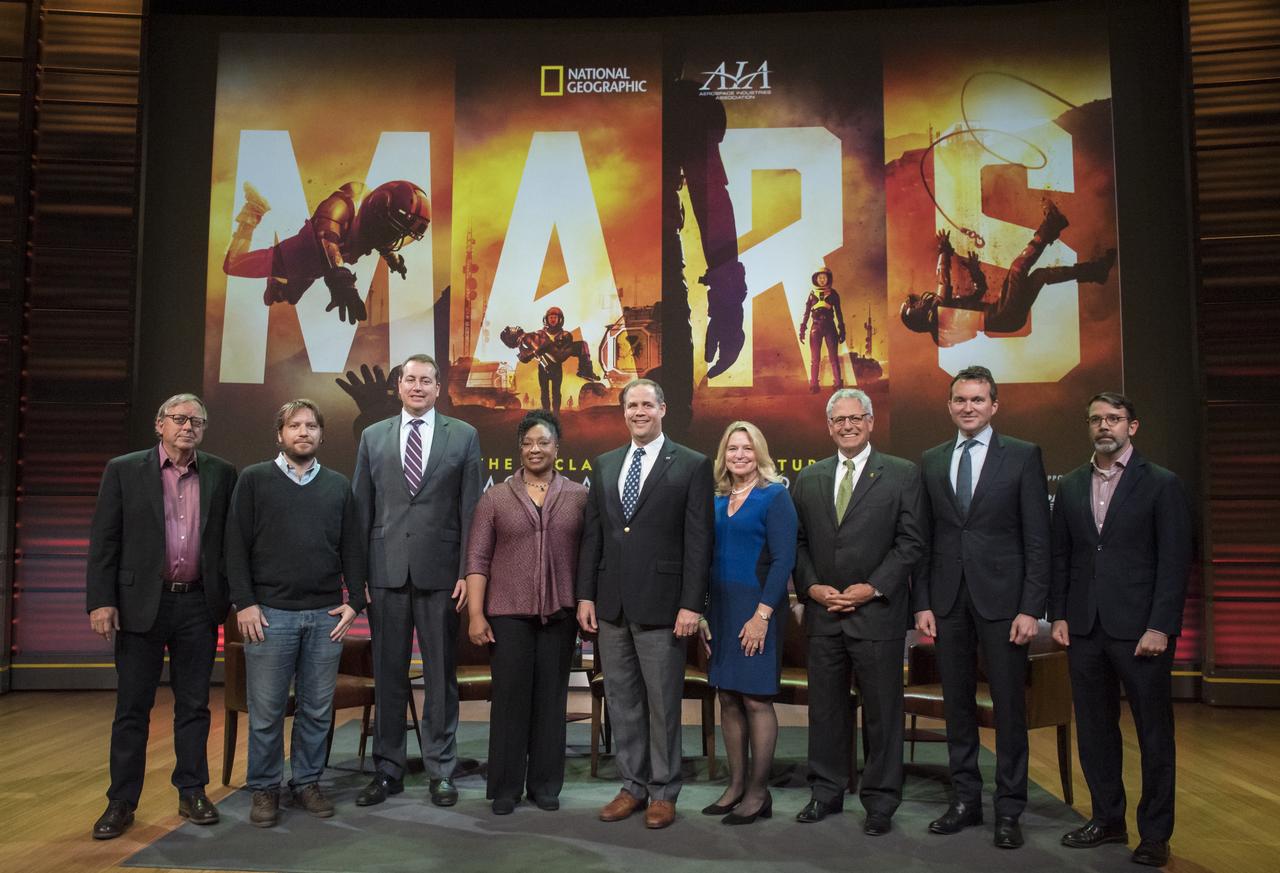 From left to right, Dr. Stephen Petranek, MARS scientific advisor and co-executive producer; Gareth Edwards, film director, Rogue One: A Star Wars Story; Jeff DeWitt, NASA chief financial officer; Christyl Johnson, deputy director for technology and research investments, NASA Goddard Space Flight Center; NASA Administrator Jim Bridenstine; Ellen Stofan, director, Smithsonian's National Air and Space Museum; Gary Knell, CEO, National Geographic Partners; Eric Fanning, AIA President and CEO; and Chris Davenport, Washington Post space reporter, pose for a photo before a showing of the Project Mars Competition's short films winners and the Mars series, Monday, November 5, 2018 at National Geographic Society Headquarters in Washington. Photo Credit: (NASA/Aubrey Gemignani)