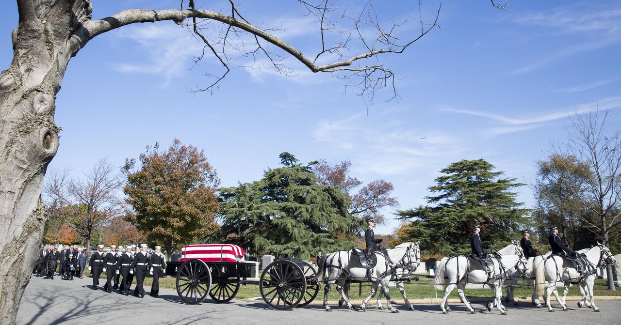 A horse drawn caisson carries former astronaut Alan Bean to his final resting place during an interment ceremony, Thursday, Nov. 8, 2018 at Arlington National Cemetery in Virginia. Selected as an astronaut in 1963, Bean flew in space twice, becoming the fourth human to walk on the Moon on Nov. 19, 1969 and spent 59 days in space as commander of the second Skylab mission in 1973. Photo Credit: (NASA/Joel Kowsky)
