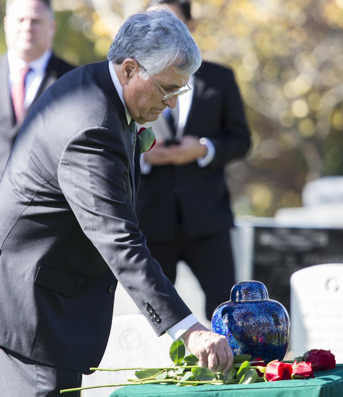 Former astronaut Harrison Schmitt places a rose next to the urn containing the ashes of former astronaut Alan Bean, Thursday, Nov. 8, 2018 at Arlington National Cemetery in Virginia. Selected as an astronaut in 1963, Bean flew in space twice, becoming the fourth human to walk on the Moon on Nov. 19, 1969 and spent 59 days in space as commander of the second Skylab mission in 1973. Photo Credit: (NASA/Joel Kowsky)