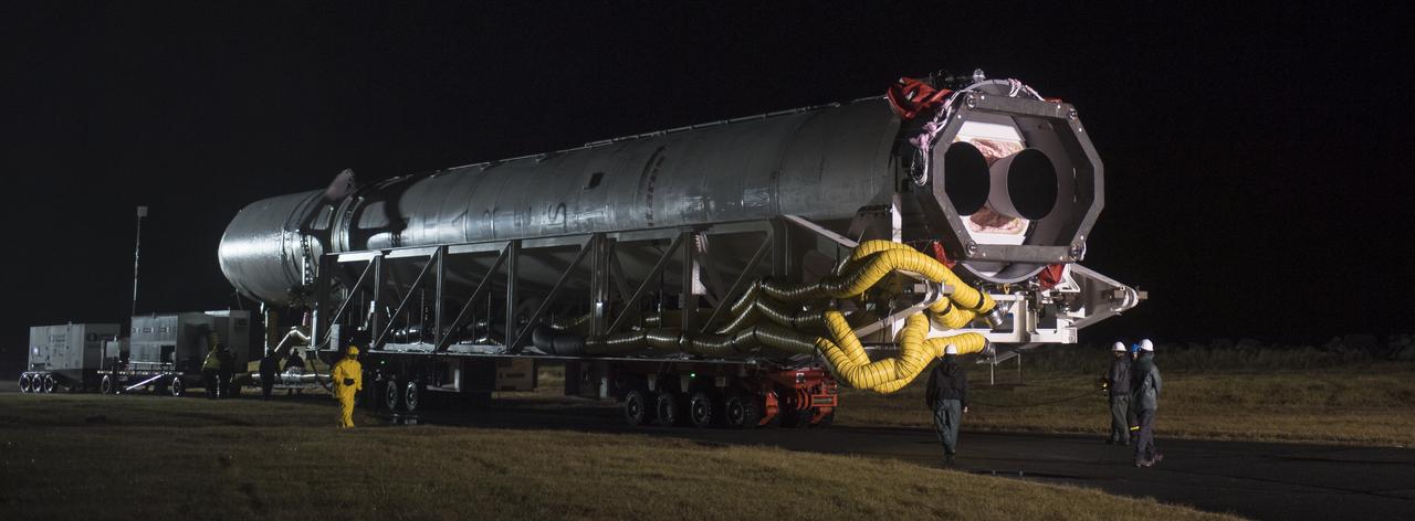 A Northrop Grumman Antares rocket is seen as it is rolled from the Horizontal Integration Facility (HIF) to Pad-0A, Monday, Nov. 12, 2018 at NASA's Wallops Flight Facility in Virginia. Northrop Grumman's 10th contracted cargo resupply mission for NASA to the International Space Station will deliver about 7,500 pounds of science and research, crew supplies and vehicle hardware to the orbital laboratory and its crew. Launch is scheduled for Nov. 15 at 4:49 a.m. EST. Photo Credit: (NASA/Joel Kowsky)