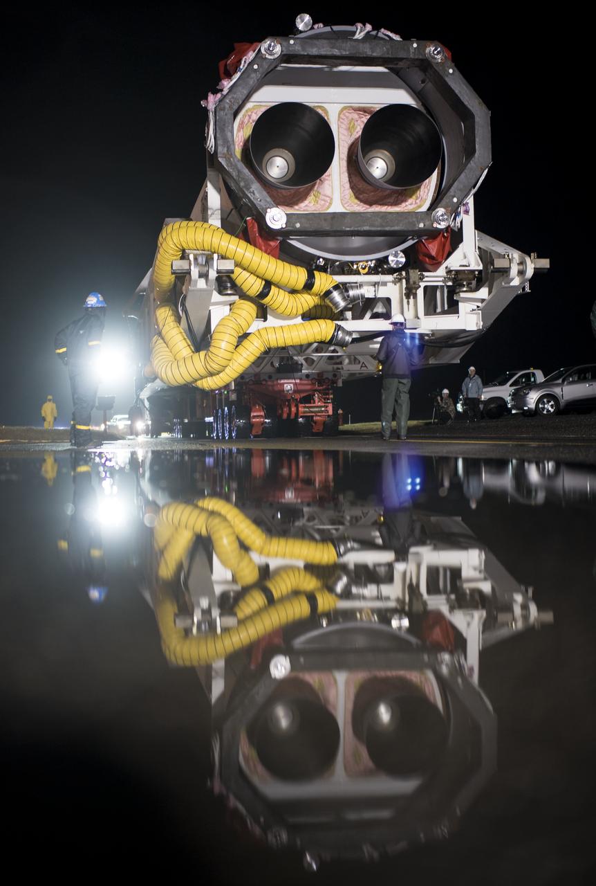 A Northrop Grumman Antares rocket is seen as it is rolled from the Horizontal Integration Facility (HIF) to Pad-0A, Monday, Nov. 12, 2018 at NASA's Wallops Flight Facility in Virginia. Northrop Grumman's 10th contracted cargo resupply mission for NASA to the International Space Station will deliver about 7,500 pounds of science and research, crew supplies and vehicle hardware to the orbital laboratory and its crew. Launch is scheduled for Nov. 15 at 4:49 a.m. EST. Photo Credit: (NASA/Joel Kowsky)