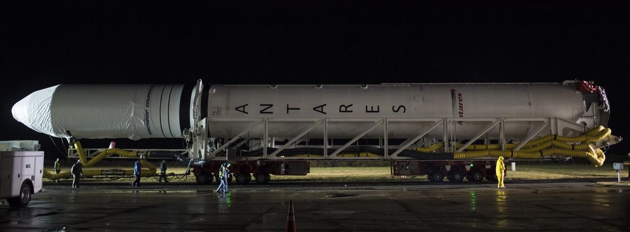 A Northrop Grumman Antares rocket is seen as it is rolled from the Horizontal Integration Facility (HIF) to Pad-0A, Monday, Nov. 12, 2018 at NASA's Wallops Flight Facility in Virginia. Northrop Grumman's 10th contracted cargo resupply mission for NASA to the International Space Station will deliver about 7,500 pounds of science and research, crew supplies and vehicle hardware to the orbital laboratory and its crew. Launch is scheduled for Nov. 15 at 4:49 a.m. EST. Photo Credit: (NASA/Joel Kowsky)