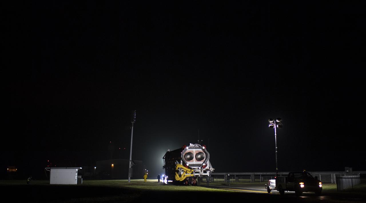 A Northrop Grumman Antares rocket is seen as it is rolled from the Horizontal Integration Facility (HIF) to Pad-0A, Monday, Nov. 12, 2018 at NASA's Wallops Flight Facility in Virginia. Northrop Grumman's 10th contracted cargo resupply mission for NASA to the International Space Station will deliver about 7,500 pounds of science and research, crew supplies and vehicle hardware to the orbital laboratory and its crew. Launch is scheduled for Nov. 15 at 4:49 a.m. EST. Photo Credit: (NASA/Joel Kowsky)