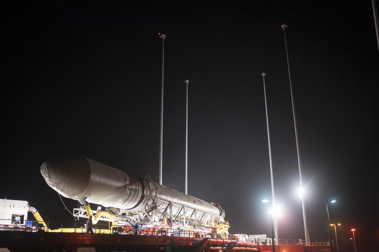 A Northrop Grumman Antares rocket is seen as arrives at Pad-0A, Monday, Nov. 12, 2018 at NASA's Wallops Flight Facility in Virginia. Northrop Grumman's 10th contracted cargo resupply mission for NASA to the International Space Station will deliver about 7,500 pounds of science and research, crew supplies and vehicle hardware to the orbital laboratory and its crew. Launch is scheduled for Nov. 15 at 4:49 a.m. EST. Photo Credit: (NASA/Joel Kowsky)
