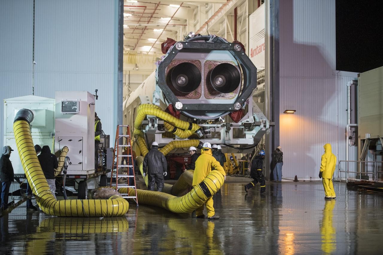 A Northrop Grumman Antares rocket is seen as it is rolled from the Horizontal Integration Facility (HIF) to Pad-0A, Monday, Nov. 12, 2018 at NASA's Wallops Flight Facility in Virginia. Northrop Grumman's 10th contracted cargo resupply mission for NASA to the International Space Station will deliver about 7,500 pounds of science and research, crew supplies and vehicle hardware to the orbital laboratory and its crew. Launch is scheduled for Nov. 15 at 4:49 a.m. EST. Photo Credit: (NASA/Joel Kowsky)