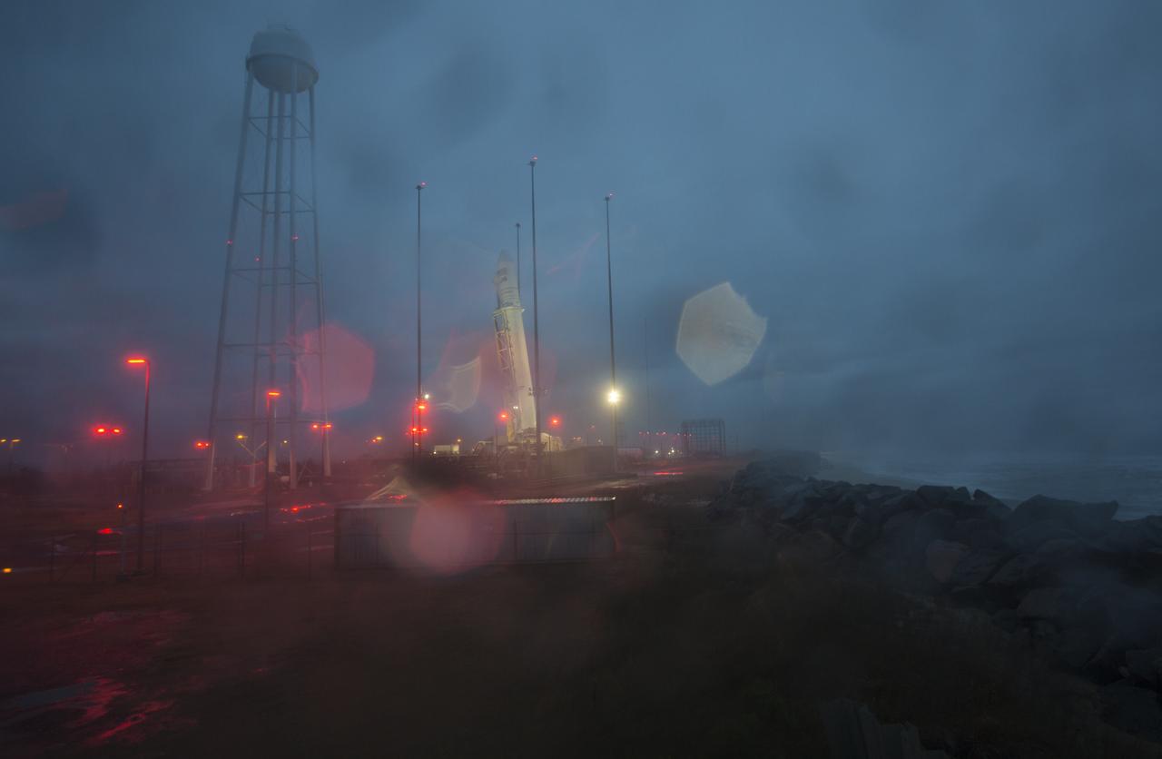 A Northrop Grumman Antares rocket, carrying a Cygnus resupply spacecraft, is seen as it is raised into a vertical position on the launch pad, Tuesday, Nov. 13, 2018 at NASA's Wallops Flight Facility in Virginia. Northrop Grumman's 10th contracted cargo resupply mission for NASA to the International Space Station will deliver about 7,500 pounds of science and research, crew supplies and vehicle hardware to the orbital laboratory and its crew. Launch is scheduled for Nov. 15 at 4:49 a.m. EST. Photo Credit: (NASA/Joel Kowsky)