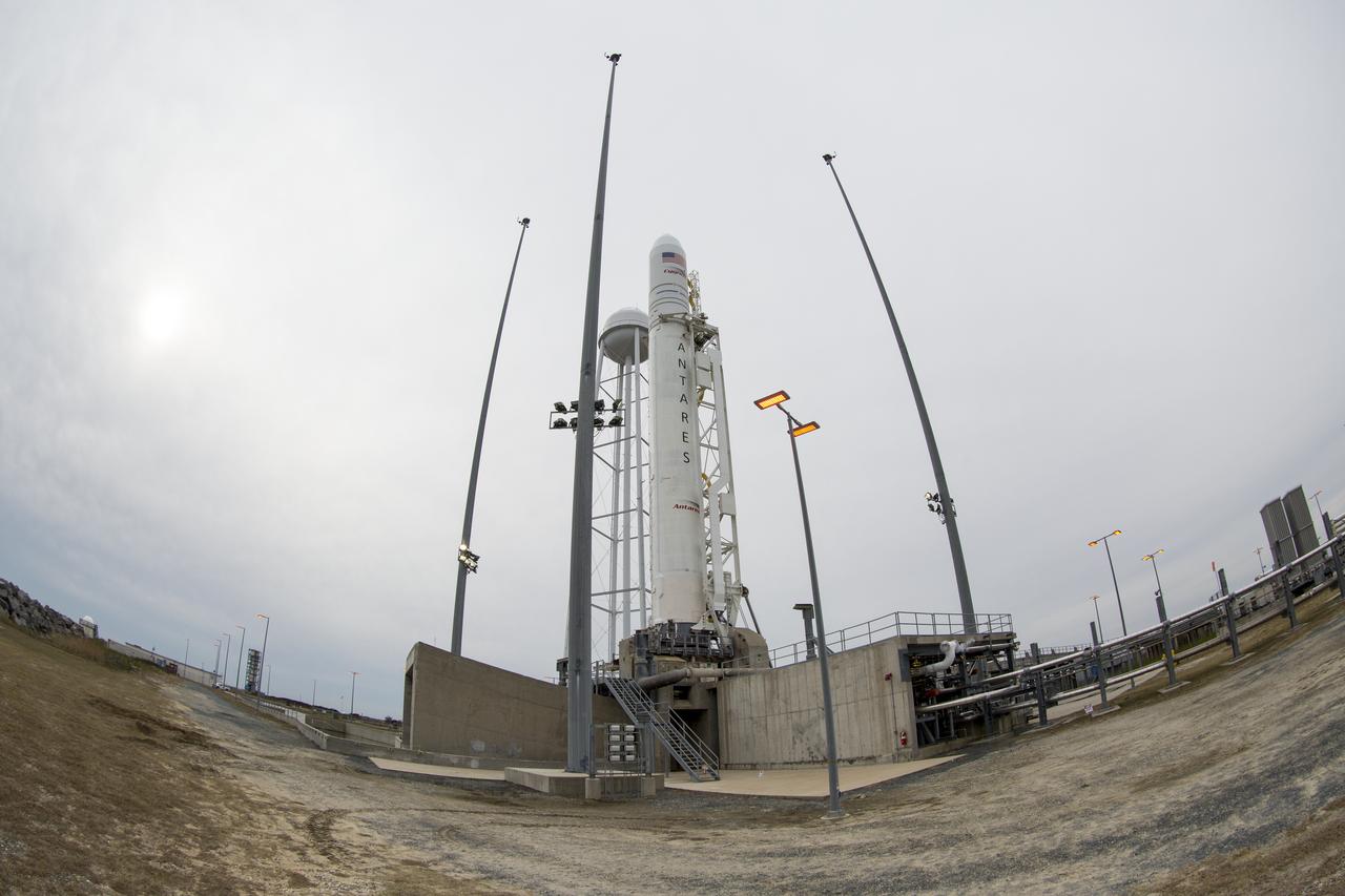 The Northrop Grumman Antares rocket, with Cygnus resupply spacecraft onboard, is seen on Pad-0A, Wednesday, Nov. 14, 2018 at NASA's Wallops Flight Facility in Virginia. Northrop Grumman's 10th contracted cargo resupply mission for NASA to the International Space Station will deliver about 7,400 pounds of science and research, crew supplies and vehicle hardware to the orbital laboratory and its crew. Launch is currently scheduled for Nov. 16 at 4:23 a.m. EST. Photo Credit: (NASA/Joel Kowsky)