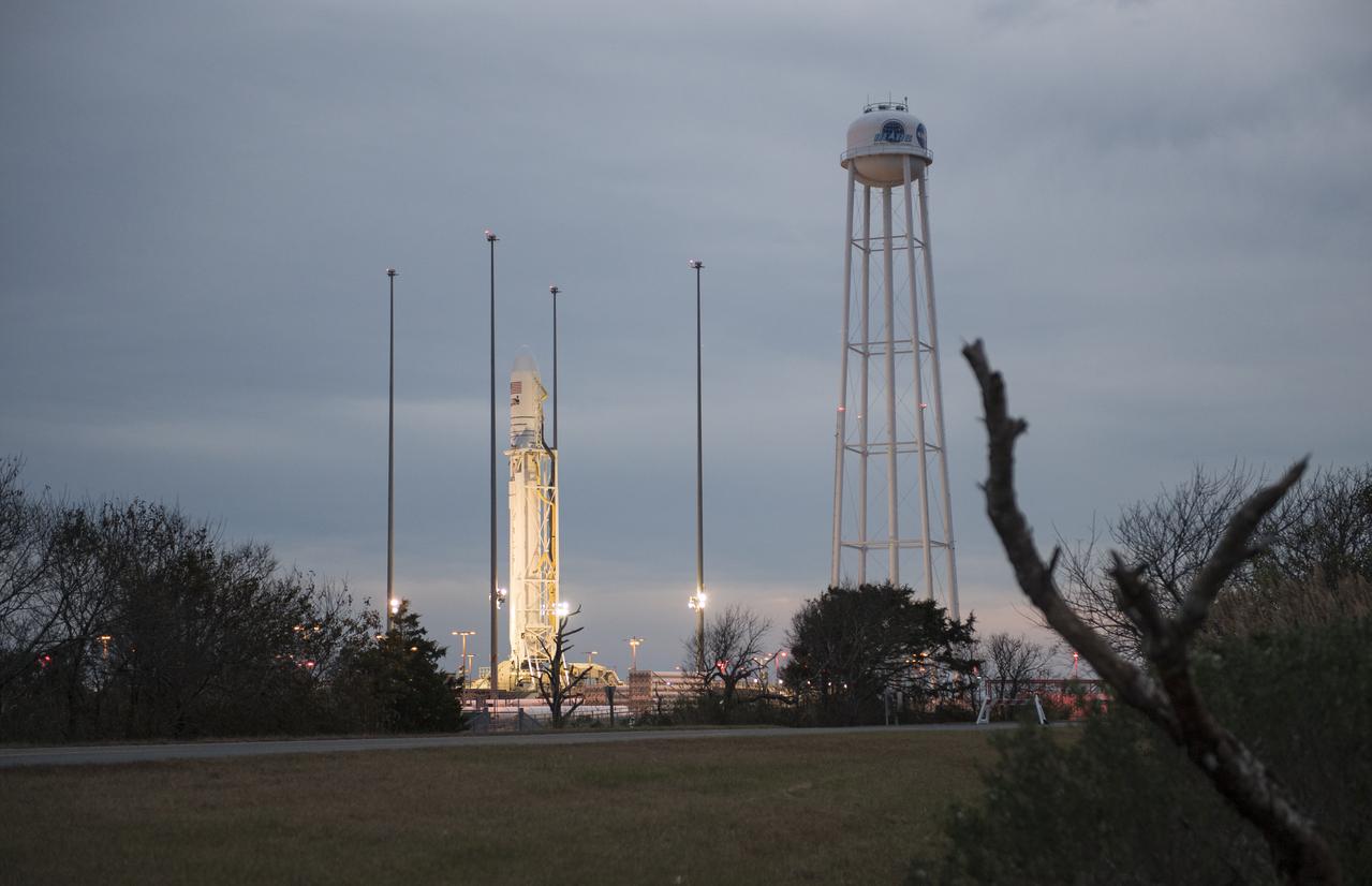 The Northrop Grumman Antares rocket, with Cygnus resupply spacecraft onboard, is seen on Pad-0A, Wednesday, Nov. 14, 2018 at NASA's Wallops Flight Facility in Virginia. Northrop Grumman's 10th contracted cargo resupply mission for NASA to the International Space Station will deliver about 7,400 pounds of science and research, crew supplies and vehicle hardware to the orbital laboratory and its crew. Launch is currently scheduled for Nov. 16 at 4:23 a.m. EST. Photo Credit: (NASA/Joel Kowsky)