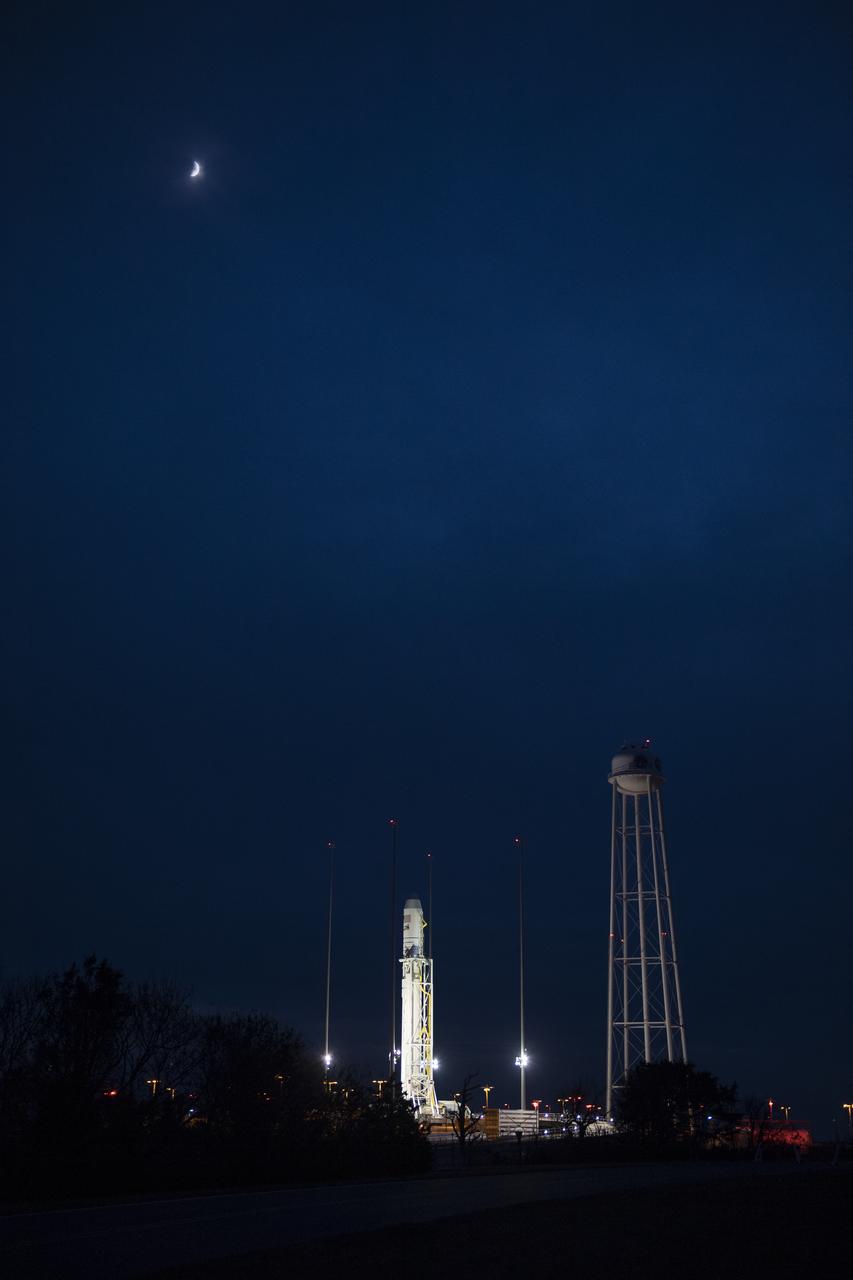 The Northrop Grumman Antares rocket, with Cygnus resupply spacecraft onboard, is seen on Pad-0A, Wednesday, Nov. 14, 2018 at NASA's Wallops Flight Facility in Virginia. Northrop Grumman's 10th contracted cargo resupply mission for NASA to the International Space Station will deliver about 7,400 pounds of science and research, crew supplies and vehicle hardware to the orbital laboratory and its crew. Launch is currently scheduled for Nov. 16 at 4:23 a.m. EST. Photo Credit: (NASA/Joel Kowsky)