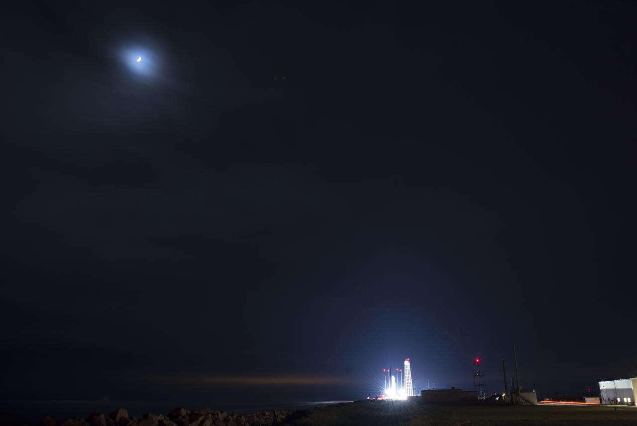The Northrop Grumman Antares rocket, with Cygnus resupply spacecraft onboard, is seen on Pad-0A, Wednesday, Nov. 14, 2018 at NASA's Wallops Flight Facility in Virginia. Northrop Grumman's 10th contracted cargo resupply mission for NASA to the International Space Station will deliver about 7,400 pounds of science and research, crew supplies and vehicle hardware to the orbital laboratory and its crew. Launch is currently scheduled for Friday, Nov. 16 at 4:23 a.m. EST. Photo Credit: (NASA/Joel Kowsky)