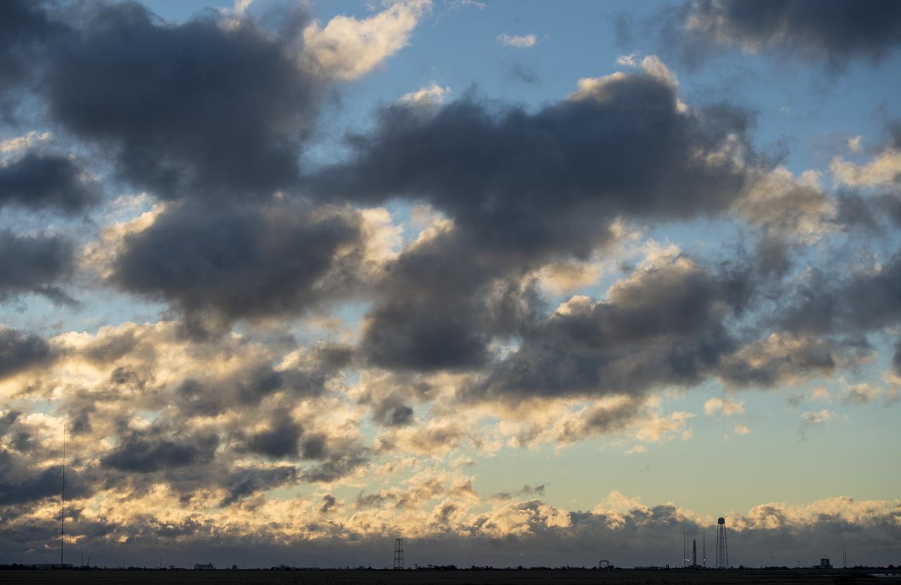 The Northrop Grumman Antares rocket, with Cygnus resupply spacecraft onboard, is seen on Pad-0A at sunrise, Friday, Nov. 16, 2018 at NASA's Wallops Flight Facility in Virginia. Northrop Grumman's 10th contracted cargo resupply mission for NASA to the International Space Station will deliver about 7,400 pounds of science and research, crew supplies and vehicle hardware to the orbital laboratory and its crew. Launch is currently scheduled for Saturday, Nov. 17 at 4:01 a.m. EST. Photo Credit: (NASA/Joel Kowsky)