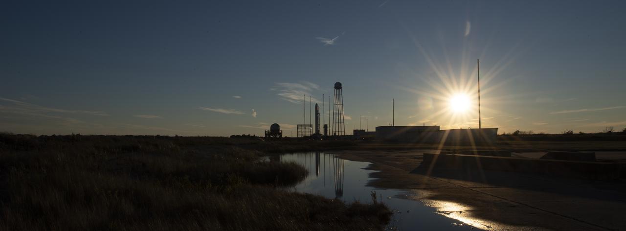 The Northrop Grumman Antares rocket, with Cygnus resupply spacecraft onboard, is seen on Pad-0A, Friday, Nov. 16, 2018 at NASA's Wallops Flight Facility in Virginia. Northrop Grumman's 10th contracted cargo resupply mission for NASA to the International Space Station will deliver about 7,400 pounds of science and research, crew supplies and vehicle hardware to the orbital laboratory and its crew. Launch is currently scheduled for Nov. 17 at 4:01 a.m. EST. Photo Credit: (NASA/Joel Kowsky)