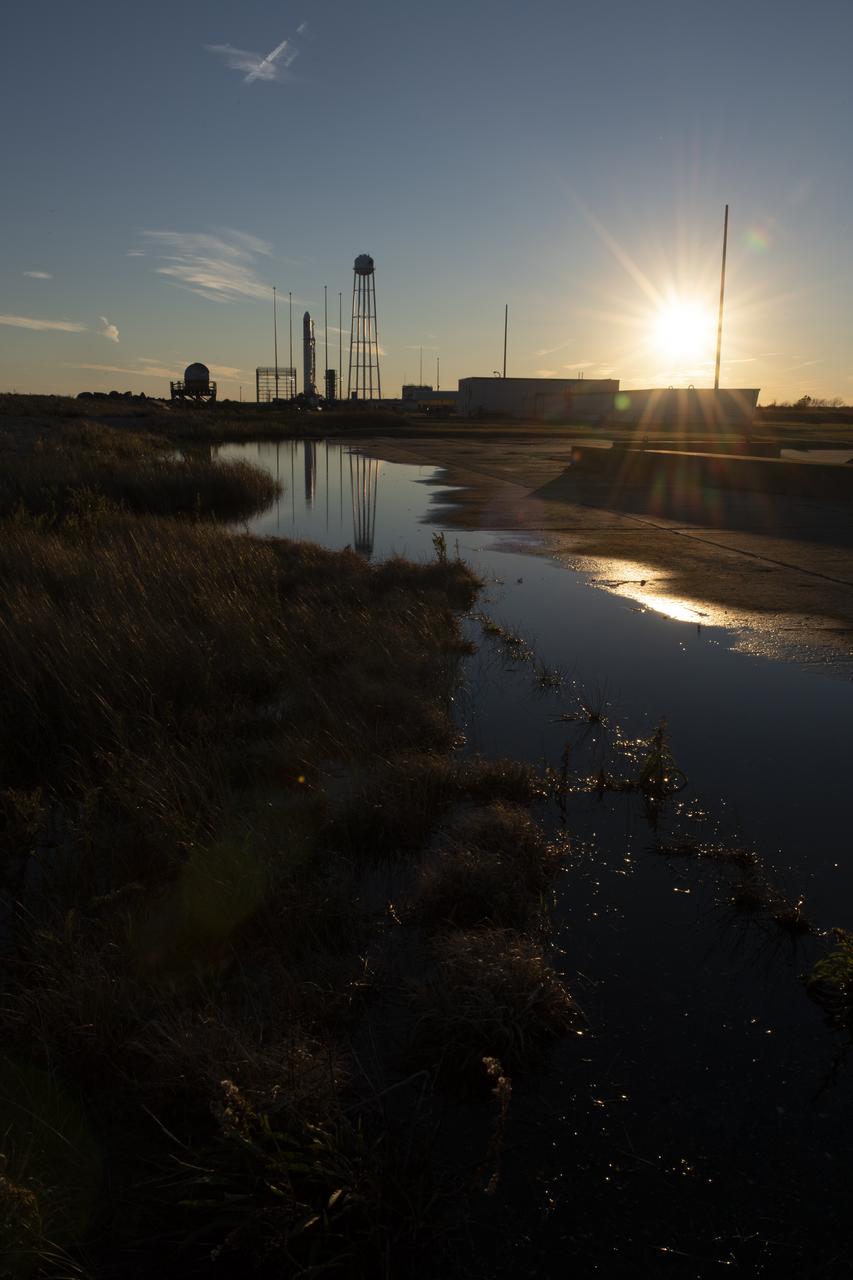 The Northrop Grumman Antares rocket, with Cygnus resupply spacecraft onboard, is seen on Pad-0A, Friday, Nov. 16, 2018 at NASA's Wallops Flight Facility in Virginia. Northrop Grumman's 10th contracted cargo resupply mission for NASA to the International Space Station will deliver about 7,400 pounds of science and research, crew supplies and vehicle hardware to the orbital laboratory and its crew. Launch is currently scheduled for Nov. 17 at 4:01 a.m. EST. Photo Credit: (NASA/Joel Kowsky)