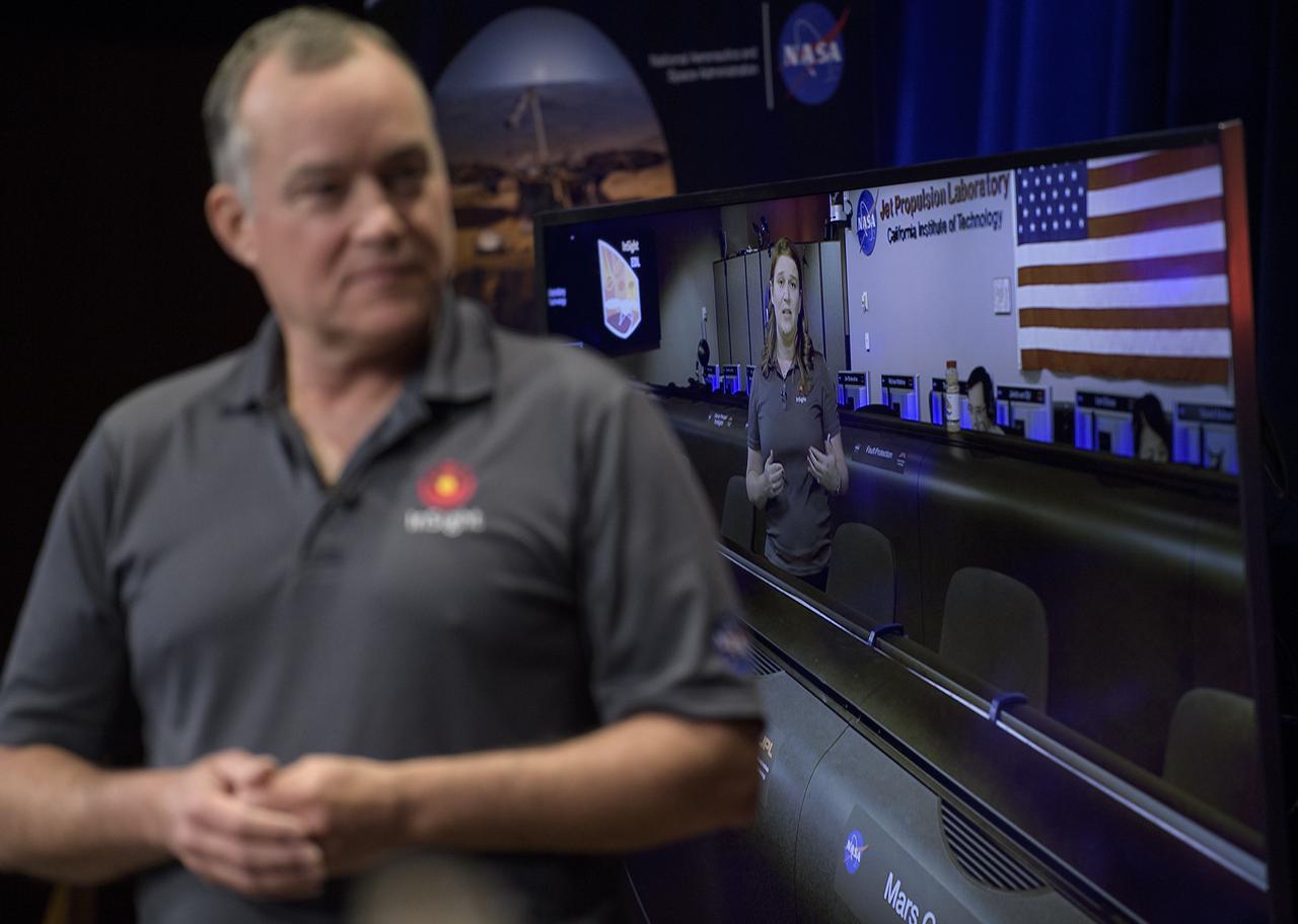 Tom Hoffman, InSight Project Manager, NASA JPL, left, listens as Julie Wertz-Chen, Entry, Descent and Landing systems engineer, NASA JPL, talks about Mars InSight from the Mission Control Area during a pre-landing briefing, Sunday, Nov. 25, 2018 at NASA's Jet Propulsion Laboratory in Pasadena, California.  InSight, short for Interior Exploration using Seismic Investigations, Geodesy and Heat Transport, is a Mars lander designed to study the "inner space" of Mars: its crust, mantle, and core. InSight is scheduled to touch down on the Red Planet at approximately noon PST (3 p.m. EST) on Nov. 26. Photo Credit: (NASA/Bill Ingalls)