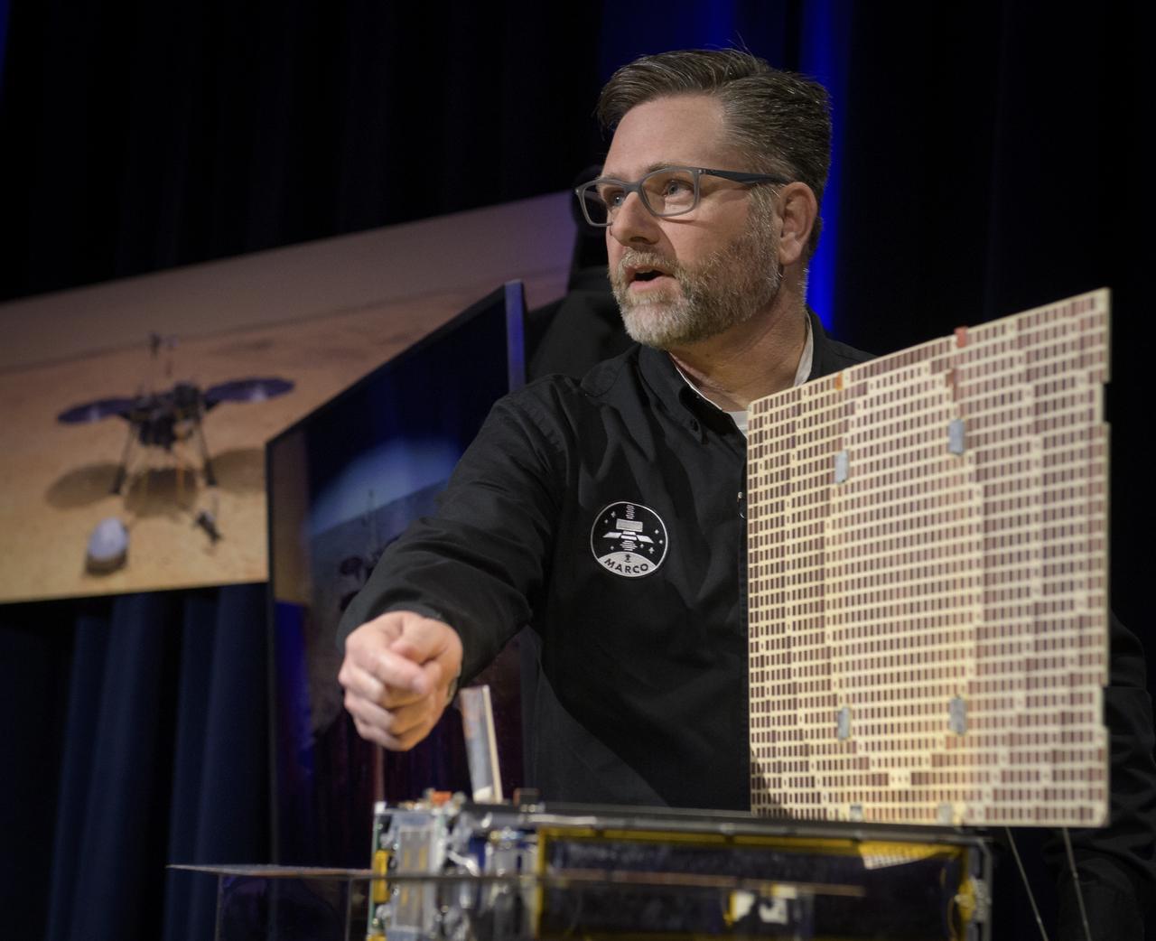 Brian Clement, Planetary Protection lead for MarCO, NASA JPL, talks about Mars Cube One (MarCO) during an Mars InSight pre-landing briefing, Sunday, Nov. 25, 2018 at NASA's Jet Propulsion Laboratory in Pasadena, California.  InSight, short for Interior Exploration using Seismic Investigations, Geodesy and Heat Transport, is a Mars lander designed to study the "inner space" of Mars: its crust, mantle, and core. InSight is scheduled to touch down on the Red Planet at approximately noon PST (3 p.m. EST) on Nov. 26. Photo Credit: (NASA/Bill Ingalls)