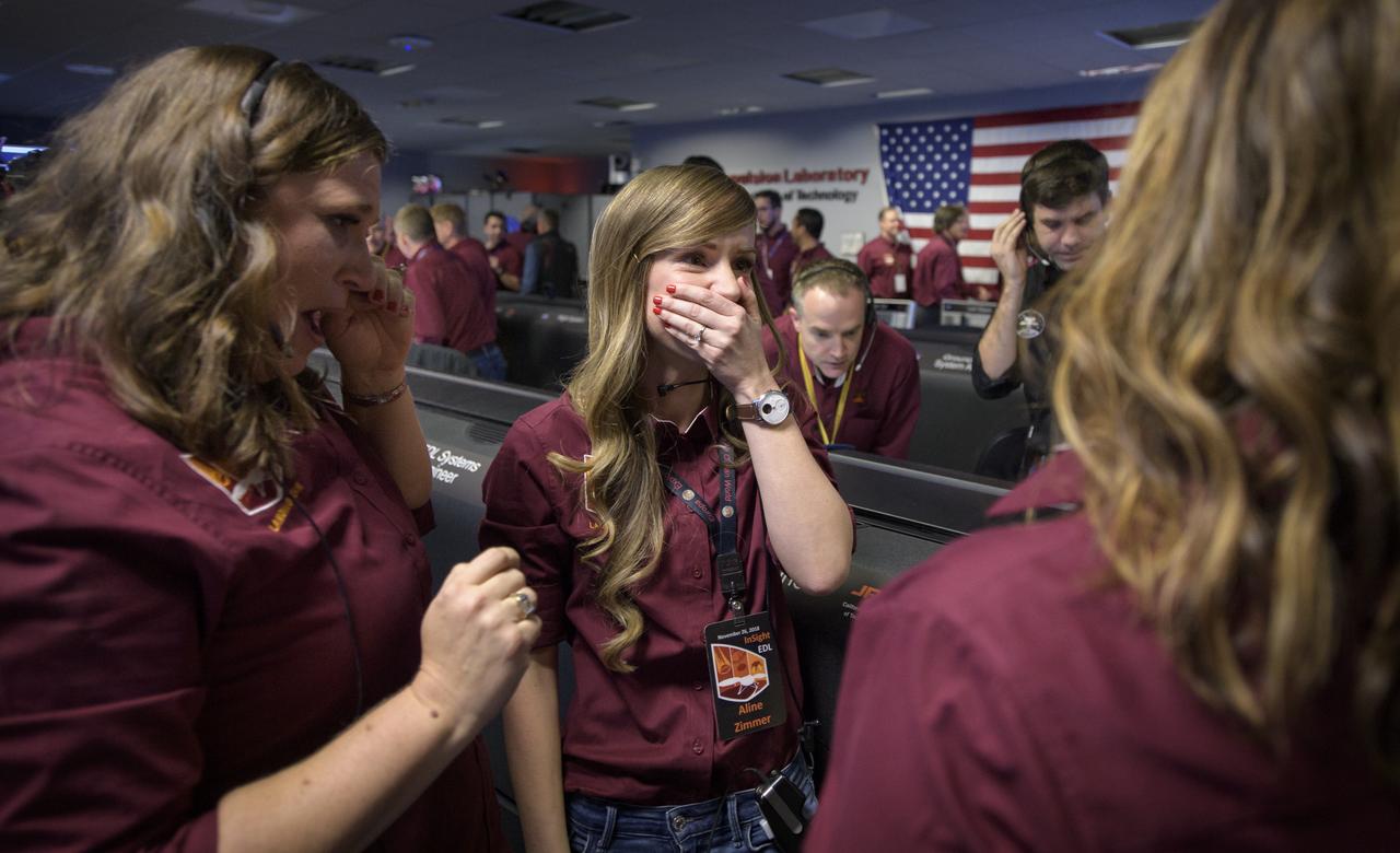 Julie Wertz-Chen, Entry, Descent and Landing systems engineer, NASA JPL, left, Aline Zimmer, Systems Engineer, NASA JPL, center, and Christine Szalai, Technical Group Supervisor, Mission Commentator, NASA JPL, all react after receiving confirmation that the Mars InSight lander successfully touched down on the surface of Mars, Monday, Nov. 26, 2018 inside the Mission Support Area at NASA's Jet Propulsion Laboratory in Pasadena, California.  InSight, short for Interior Exploration using Seismic Investigations, Geodesy and Heat Transport, is a Mars lander designed to study the "inner space" of Mars: its crust, mantle, and core. Photo Credit: (NASA/Bill Ingalls)