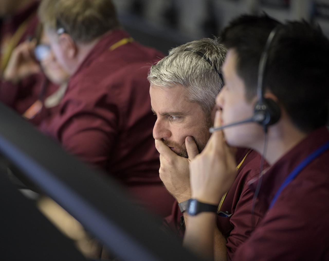 Mars InSight team members monitor the status of the lander prior to it touching down on Mars, Monday, Nov. 26, 2018 inside the Mission Support Area at NASA's Jet Propulsion Laboratory in Pasadena, California.  InSight, short for Interior Exploration using Seismic Investigations, Geodesy and Heat Transport, is a Mars lander designed to study the "inner space" of Mars: its crust, mantle, and core. Photo Credit: (NASA/Bill Ingalls)