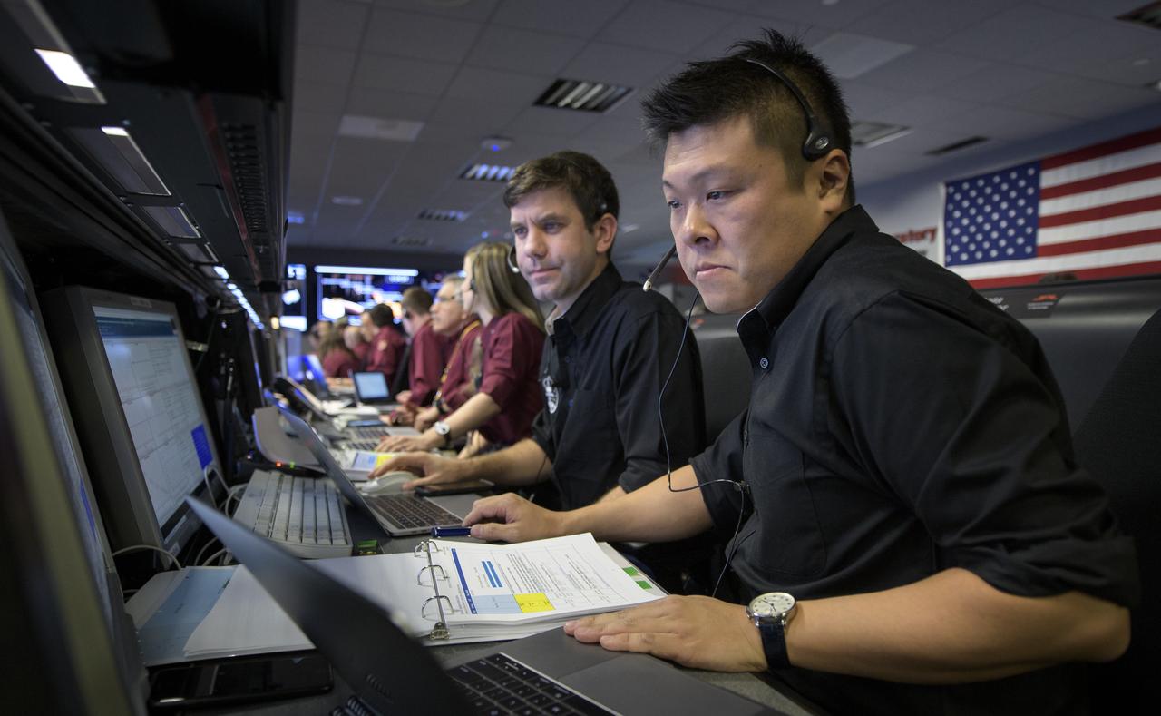 Mike Kobayashi, MarCO telecoms, right, and Andy Klesh, MarCO Chief Engineer, monitor the status of the Mars Cube One (MarCO) CubeSats  prior to Mars InSight touching down on Mars, Monday, Nov. 26, 2018 inside the Mission Support Area at NASA's Jet Propulsion Laboratory in Pasadena, California.  InSight, short for Interior Exploration using Seismic Investigations, Geodesy and Heat Transport, is a Mars lander designed to study the "inner space" of Mars: its crust, mantle, and core. Photo Credit: (NASA/Bill Ingalls)