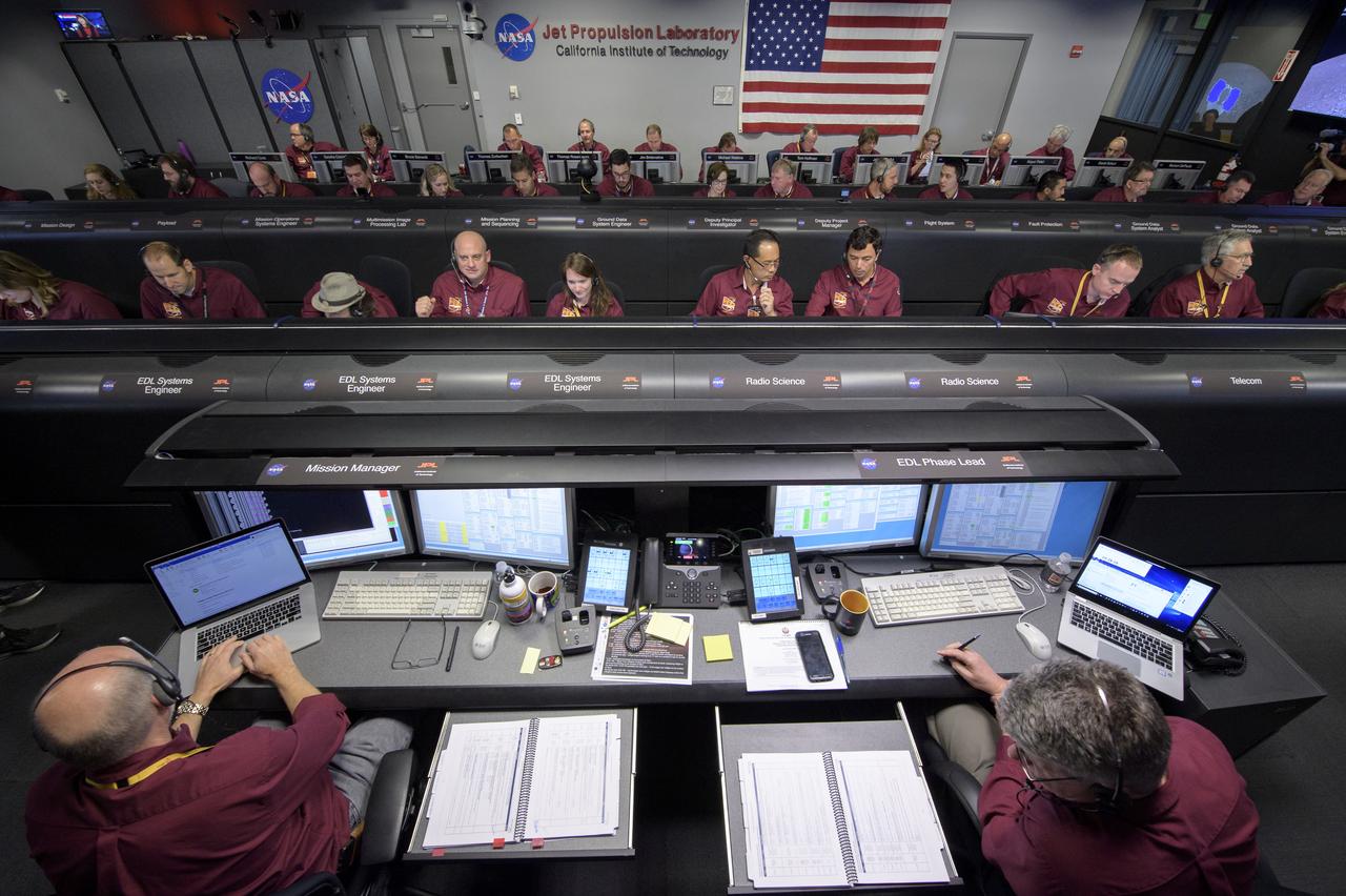 Mars InSight team members monitor the status of the lander prior to it touching down on Mars, Monday, Nov. 26, 2018 inside the Mission Support Area at NASA's Jet Propulsion Laboratory in Pasadena, California.  InSight, short for Interior Exploration using Seismic Investigations, Geodesy and Heat Transport, is a Mars lander designed to study the "inner space" of Mars: its crust, mantle, and core. Photo Credit: (NASA/Bill Ingalls)