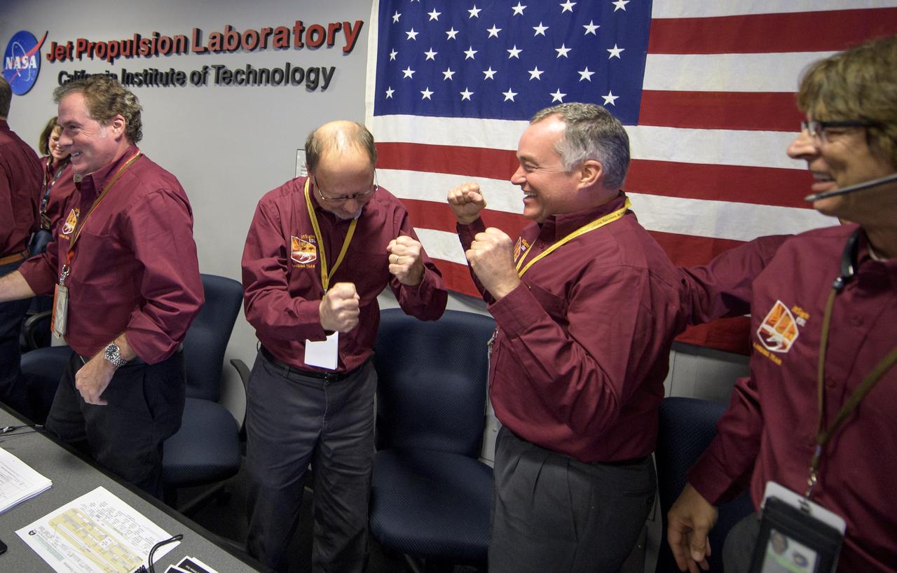 Bruce Banerdt, InSight Principal Investigator, NASA JPL, center left, and Tom Hoffman, InSight Project Manager, NASA JPL, rejoice after receiving confirmation that the Mars InSight lander successfully touched down on the surface of Mars, Monday, Nov. 26, 2018 inside the Mission Support Area at NASA's Jet Propulsion Laboratory in Pasadena, California.  InSight, short for Interior Exploration using Seismic Investigations, Geodesy and Heat Transport, is a Mars lander designed to study the "inner space" of Mars: its crust, mantle, and core. Photo Credit: (NASA/Bill Ingalls)