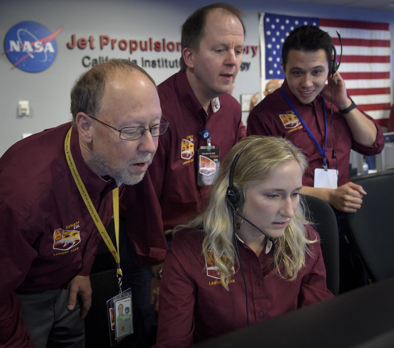 Bruce Banerdt, InSight Principal Investigator, NASA JPL, left, Hallie Gengl, Data Visualization Developer, seated, and other Mars InSight team members, anxiously watch for the first image to be received from the Mars InSight lander after it touched down on the surface of Mars, Monday, Nov. 26, 2018 inside the Mission Support Area at NASA's Jet Propulsion Laboratory in Pasadena, California. InSight, short for Interior Exploration using Seismic Investigations, Geodesy and Heat Transport, is a Mars lander designed to study the "inner space" of Mars: its crust, mantle, and core. Photo Credit: (NASA/Bill Ingalls)