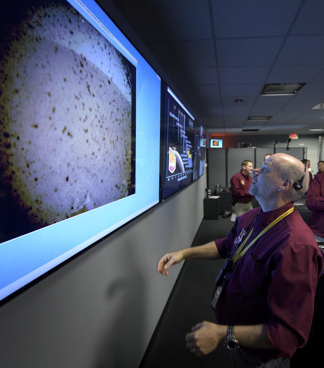 Rick Welch, System Manager, NASA JPL reacts to the first image to be seen from the Mars InSight lander shortly after confirmation of a successful touch down on the surface of Mars, Monday, Nov. 26, 2018 inside the Mission Support Area at NASA's Jet Propulsion Laboratory in Pasadena, California. InSight, short for Interior Exploration using Seismic Investigations, Geodesy and Heat Transport, is a Mars lander designed to study the "inner space" of Mars: its crust, mantle, and core. Photo Credit: (NASA/Bill Ingalls)