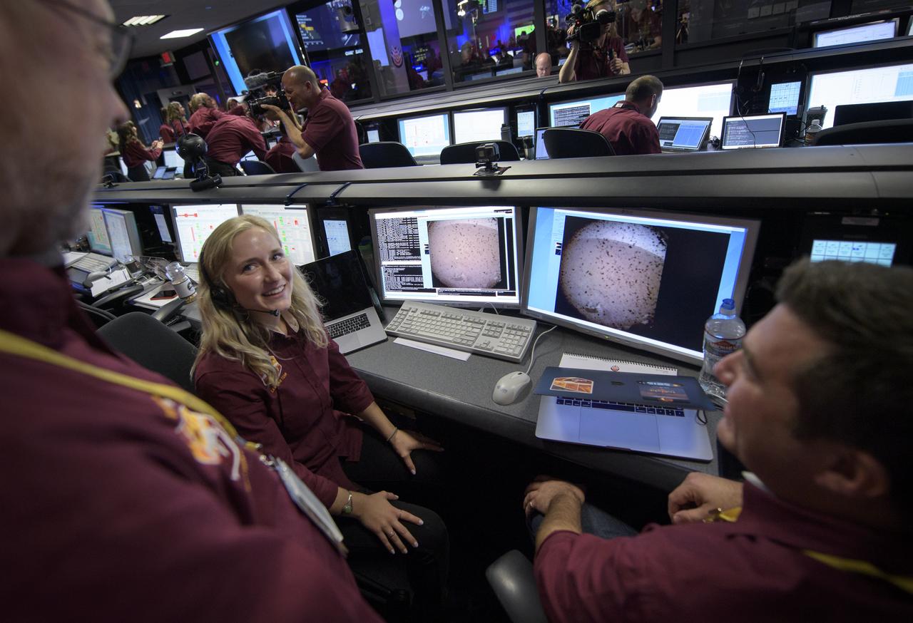Hallie Gengl, Data Visualization Developer, NASA JPL, left, and Brent Shockley, Systems Engineer, NASA, APL, right, talk with Bruce Banerdt, InSight Principal Investigator, NASA JPL, after reviewing the first image of Mars from the Mars InSight lander, Monday, Nov. 26, 2018 inside the Mission Support Area at NASA's Jet Propulsion Laboratory in Pasadena, California.  InSight, short for Interior Exploration using Seismic Investigations, Geodesy and Heat Transport, is a Mars lander designed to study the "inner space" of Mars: its crust, mantle, and core. Photo Credit: (NASA/Bill Ingalls)