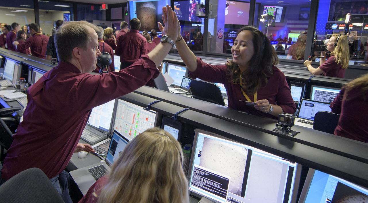 Mars InSight team members all react after receiving confirmation that the Mars InSight lander successfully touched down on the surface of Mars, Monday, Nov. 26, 2018 inside the Mission Support Area at NASA's Jet Propulsion Laboratory in Pasadena, California. InSight, short for Interior Exploration using Seismic Investigations, Geodesy and Heat Transport, is a Mars lander designed to study the "inner space" of Mars: its crust, mantle, and core. Photo Credit: (NASA/Bill Ingalls)
