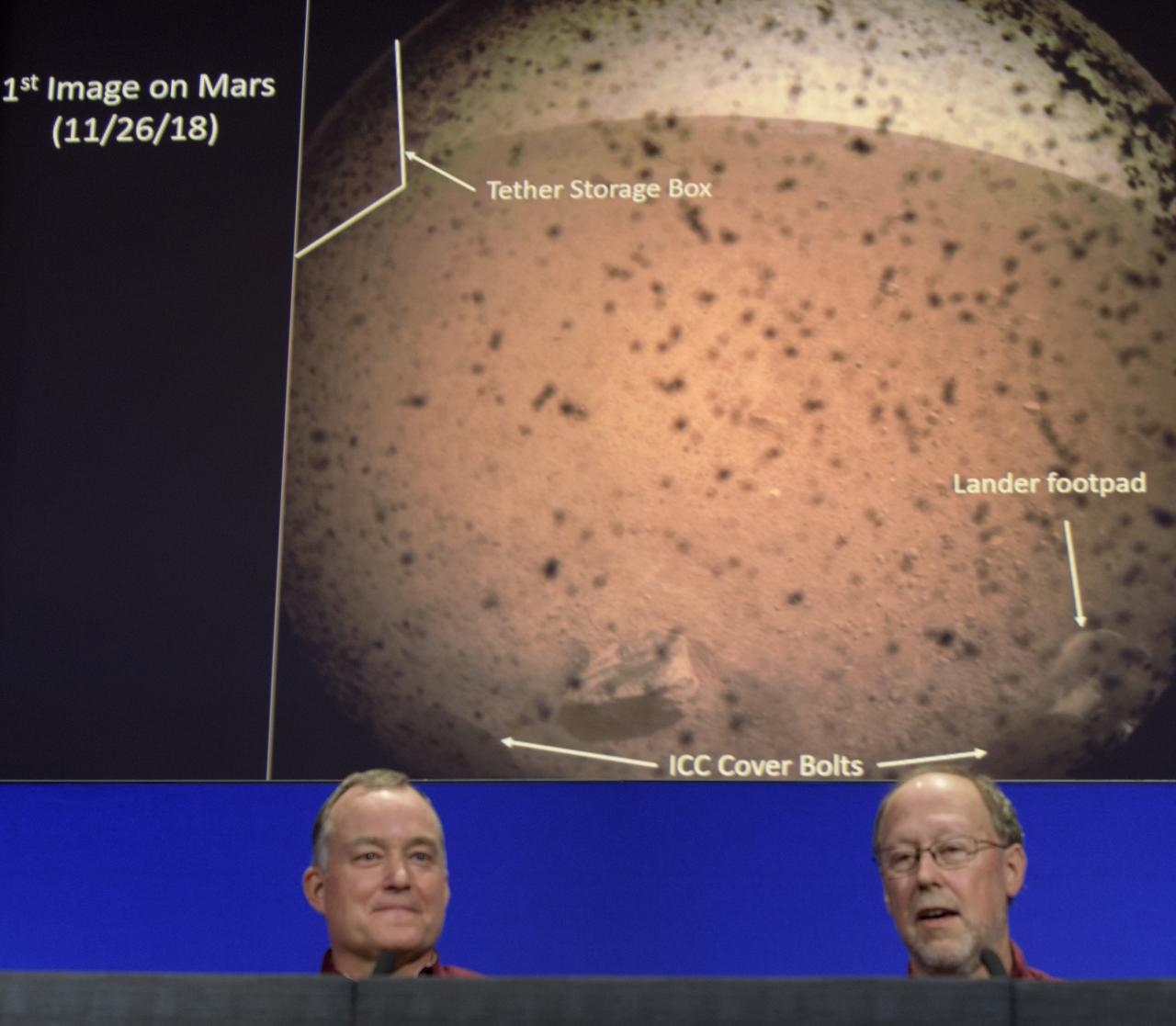 Tom Hoffman, InSight Project Manager, NASA JPL, left, and Bruce Banerdt, InSight Principal Investigator, NASA JPL, describe the first image sent back by the Mars InSight lander during a post-landing press conference, Monday, Nov. 26, 2018 at NASA's Jet Propulsion Laboratory in Pasadena, California. InSight, short for Interior Exploration using Seismic Investigations, Geodesy and Heat Transport, is a Mars lander designed to study the "inner space" of Mars: its crust, mantle, and core. Photo Credit: (NASA/Bill Ingalls)