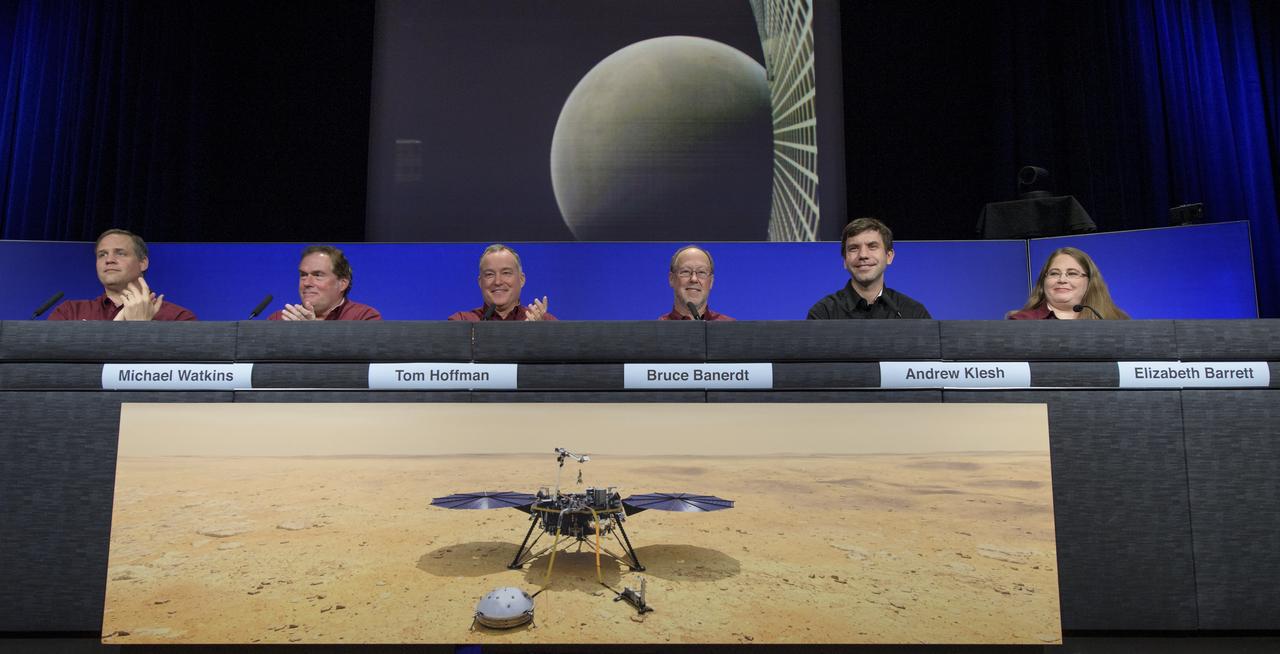 NASA Administrator Jim Bridenstine, left, JPL Director Michael Watkins, InSight Project Manager Tom Hoffman, InSight Principal Investigator Bruce Banerdt, MarCO chief engineer Andy Klesh, and InSight Instrument Operations Lead Elizabeth Barrett, show an image of Mars made by one of the Mars Cube One CubeSats during a Mars InSight post-landing press conference, Monday, Nov. 26, 2018 at NASA's Jet Propulsion Laboratory in Pasadena, California. InSight, short for Interior Exploration using Seismic Investigations, Geodesy and Heat Transport, is a Mars lander designed to study the "inner space" of Mars: its crust, mantle, and core. Photo Credit: (NASA/Bill Ingalls)