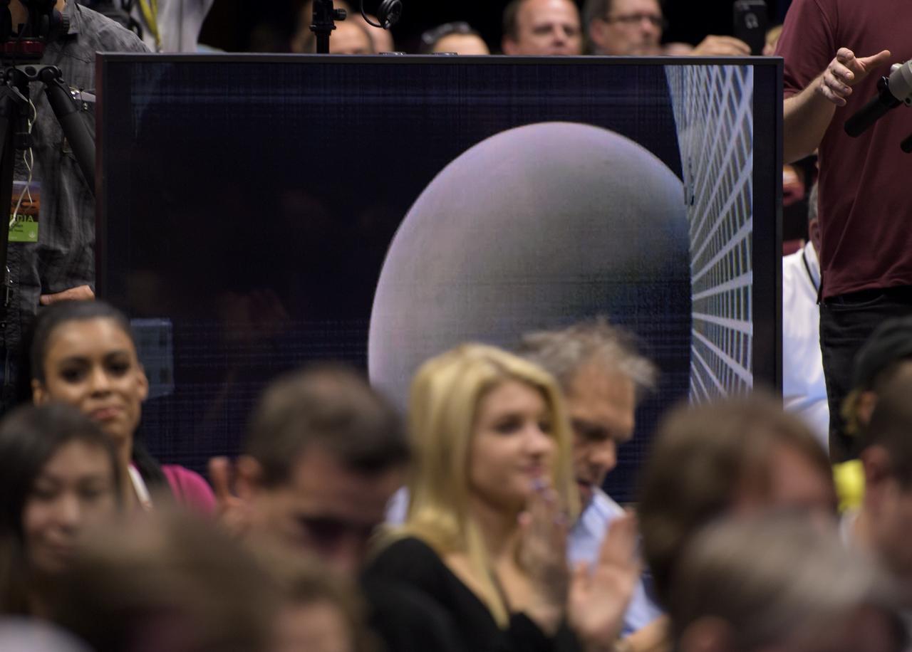 An image of Mars made by one of the Mars Cube One CubeSats is shown during a Mars InSight post-landing press conference, Monday, Nov. 26, 2018 at NASA's Jet Propulsion Laboratory in Pasadena, California. InSight, short for Interior Exploration using Seismic Investigations, Geodesy and Heat Transport, is a Mars lander designed to study the "inner space" of Mars: its crust, mantle, and core. Photo Credit: (NASA/Bill Ingalls)