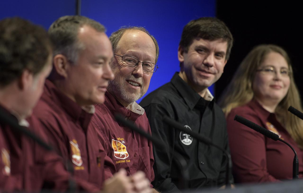 Bruce Banerdt, InSight Principal Investigator, NASA JPL, center, listens as other Mars InSight team members give remarks during a post-landing press conference, Monday, Nov. 26, 2018 at NASA's Jet Propulsion Laboratory in Pasadena, California. InSight, short for Interior Exploration using Seismic Investigations, Geodesy and Heat Transport, is a Mars lander designed to study the "inner space" of Mars: its crust, mantle, and core. Photo Credit: (NASA/Bill Ingalls)