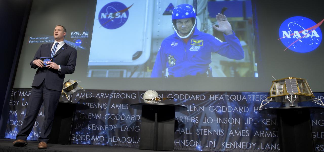 NASA Administrator Jim Bridenstine talks via satellite with NASA astronaut Stan Love from NASA’s Johnson Space Center in Houston during an event where it was announced that nine U.S. companies are eligible to bid on NASA delivery services to the lunar surface through Commercial Lunar Payload Services (CLPS) contracts, Thursday, Nov. 29, 2018 at NASA Headquarters in Washington. The companies will be able to bid on delivering science and technology payloads for NASA, including payload integration and operations, launching from Earth and landing on the surface of the Moon. NASA expects to be one of many customers that will use these commercial landing services. Photo Credit: (NASA/Bill Ingalls)