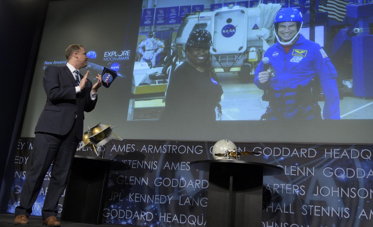 NASA Administrator Jim Bridenstine talks via satellite with Andrea Mosie, Apollo sample laboratory manager, and NASA astronaut Stan Love from NASA’s Johnson Space Center in Houston during a event where it was announced that nine U.S. companies are eligible to bid on NASA delivery services to the lunar surface through Commercial Lunar Payload Services (CLPS) contracts, Thursday, Nov. 29, 2018 at NASA Headquarters in Washington. The companies will be able to bid on delivering science and technology payloads for NASA, including payload integration and operations, launching from Earth and landing on the surface of the Moon. NASA expects to be one of many customers that will use these commercial landing services. Photo Credit: (NASA/Bill Ingalls)