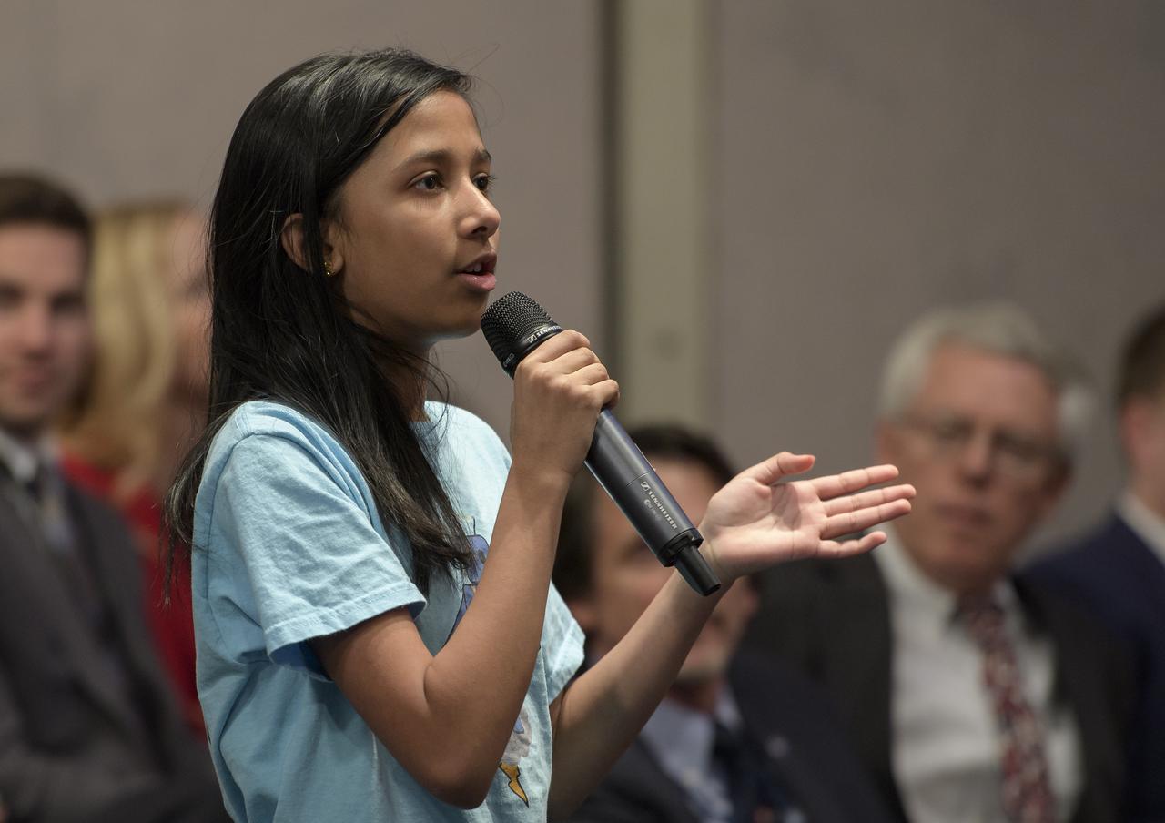 A Cascades Thunderbots "Robotics for Youth" team member from Sterling, Virginia asks a question during an Commercial Lunar Payload Services (CLPS) announcement, Thursday, Nov. 29, 2018 at NASA Headquarters in Washington. Nine companies will be able to bid on delivering science and technology payloads for NASA, including payload integration and operations, launching from Earth and landing on the surface of the Moon. NASA expects to be one of many customers that will use these commercial landing services. Photo Credit: (NASA/Bill Ingalls)